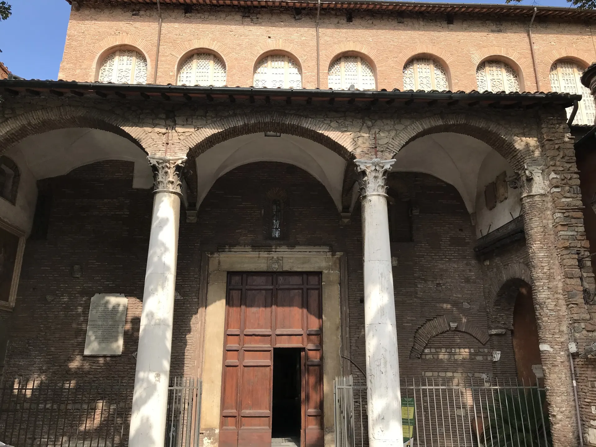 Brick exterior and columned portico of the Basilica of Santa Sabina on the Aventine.