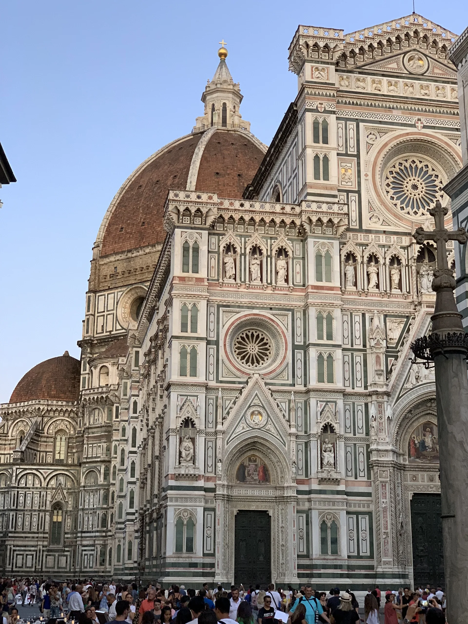 The Baptistery of San Giovanni with the Duomo facade and Brunelleschi's dome rising behind