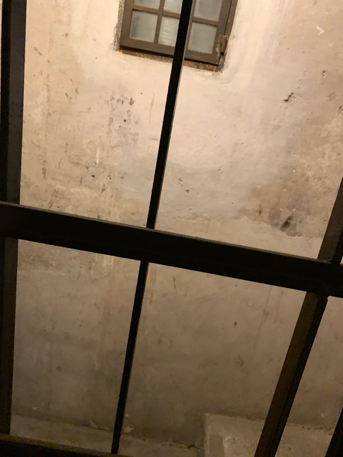 The white coffered interior passage of the Bridge of Sighs