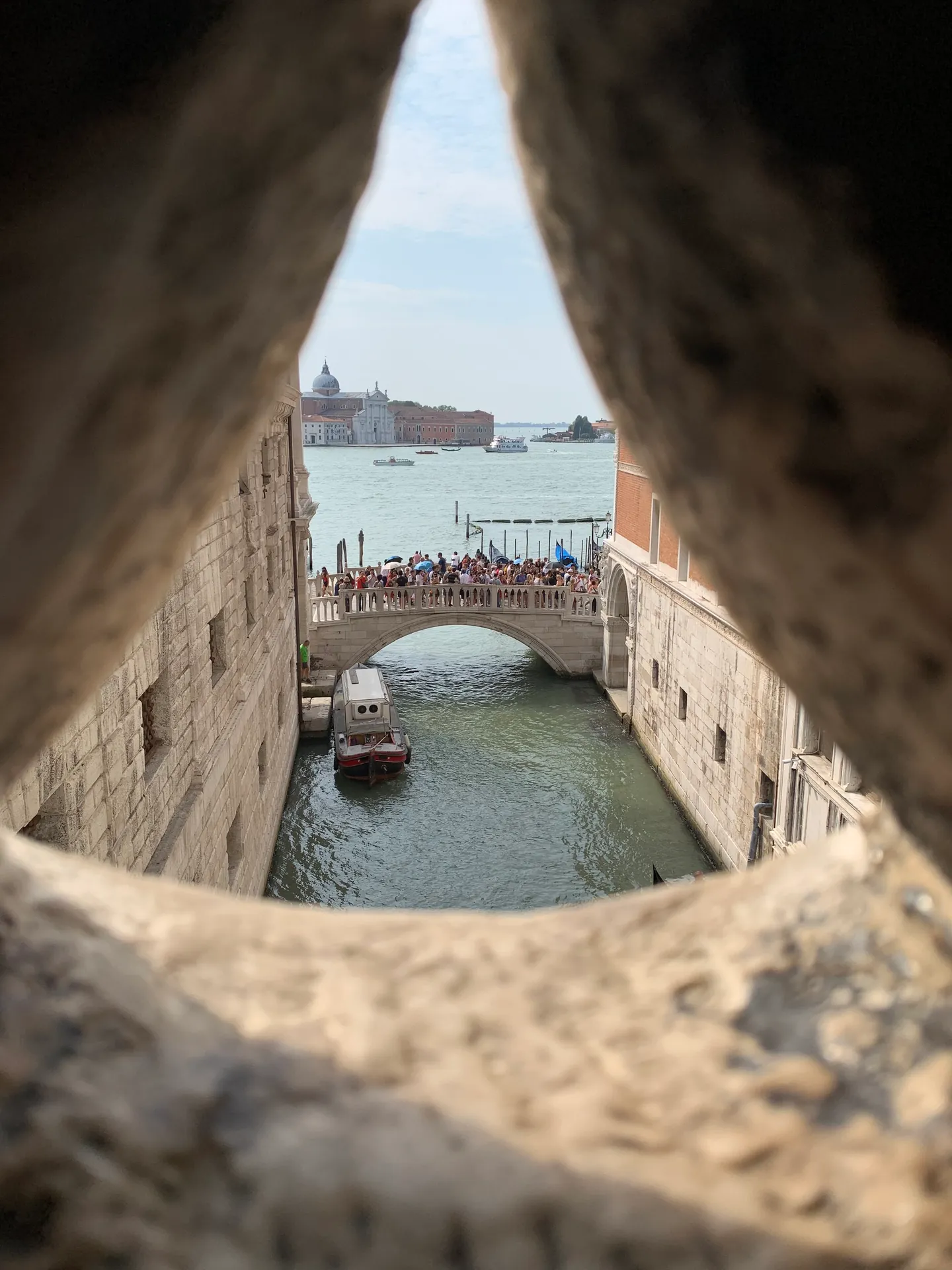 San Giorgio Maggiore and the lagoon seen through the stone lattice of the Bridge of Sighs