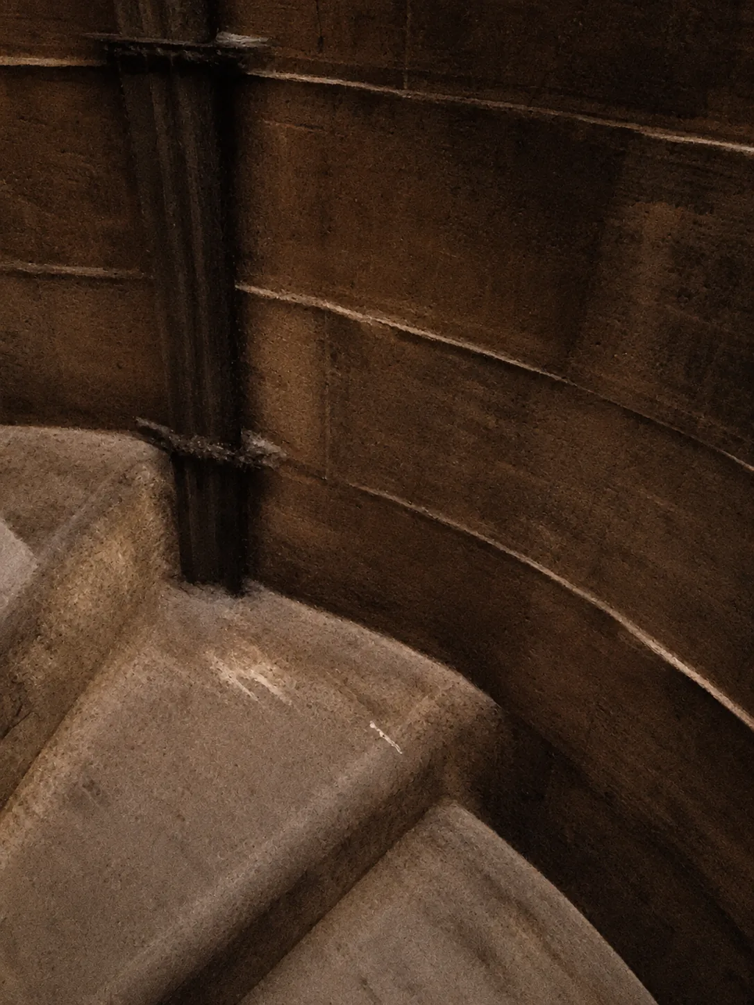 A curved stone passage and worn stone steps inside Brunelleschi's dome on the climb
