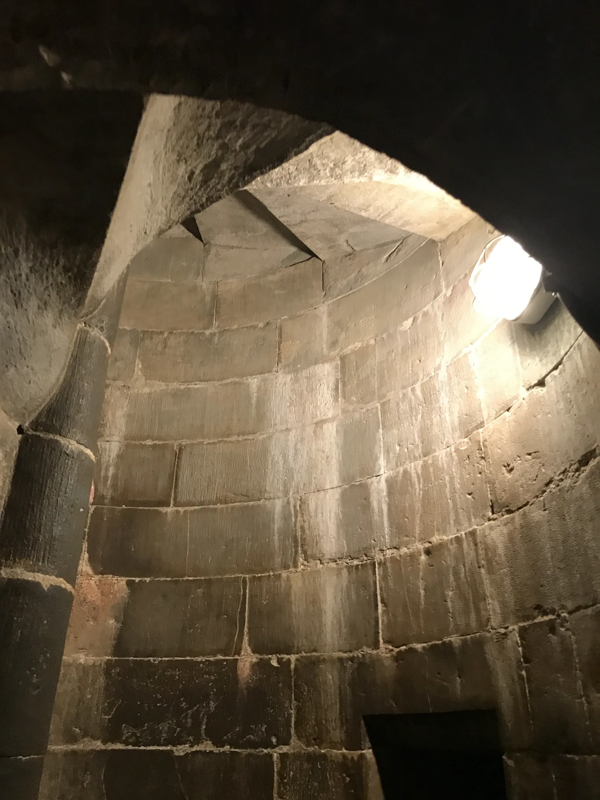 A narrow stone spiral staircase inside the walls of Brunelleschi's dome on the climb up