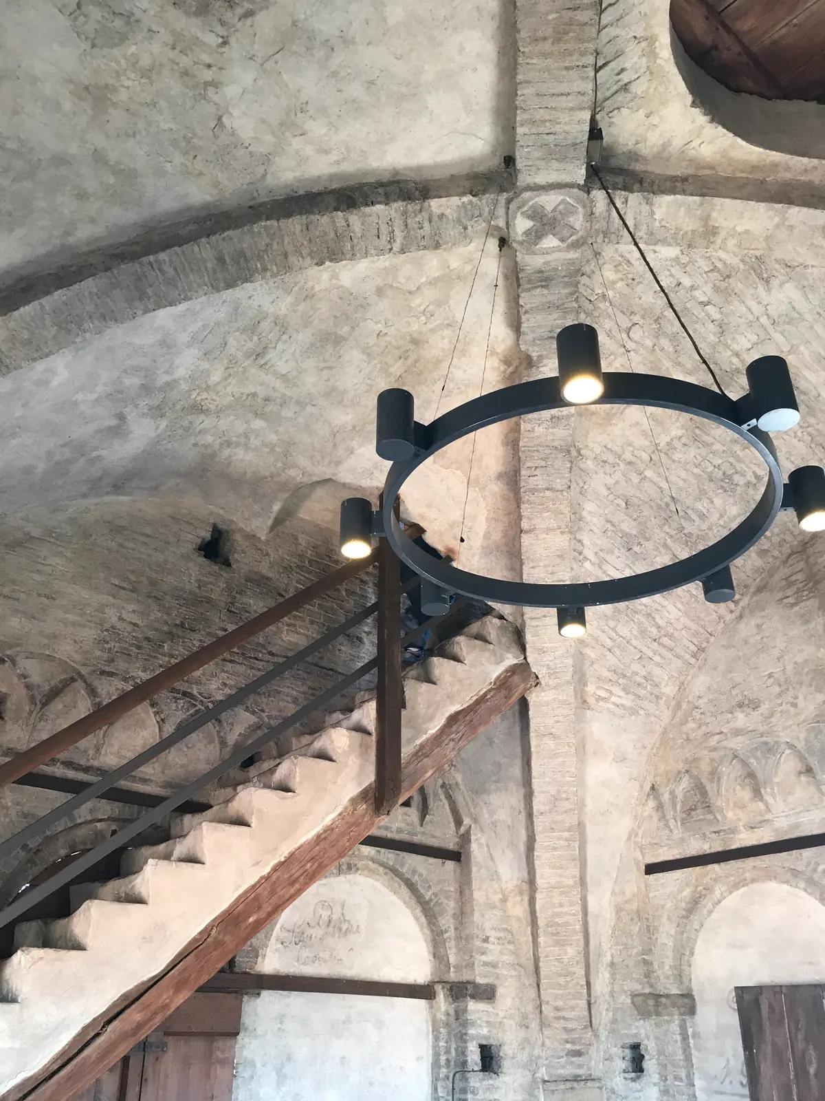 Vaulted brick ceiling of the bell chamber with a circular ring of lamps.