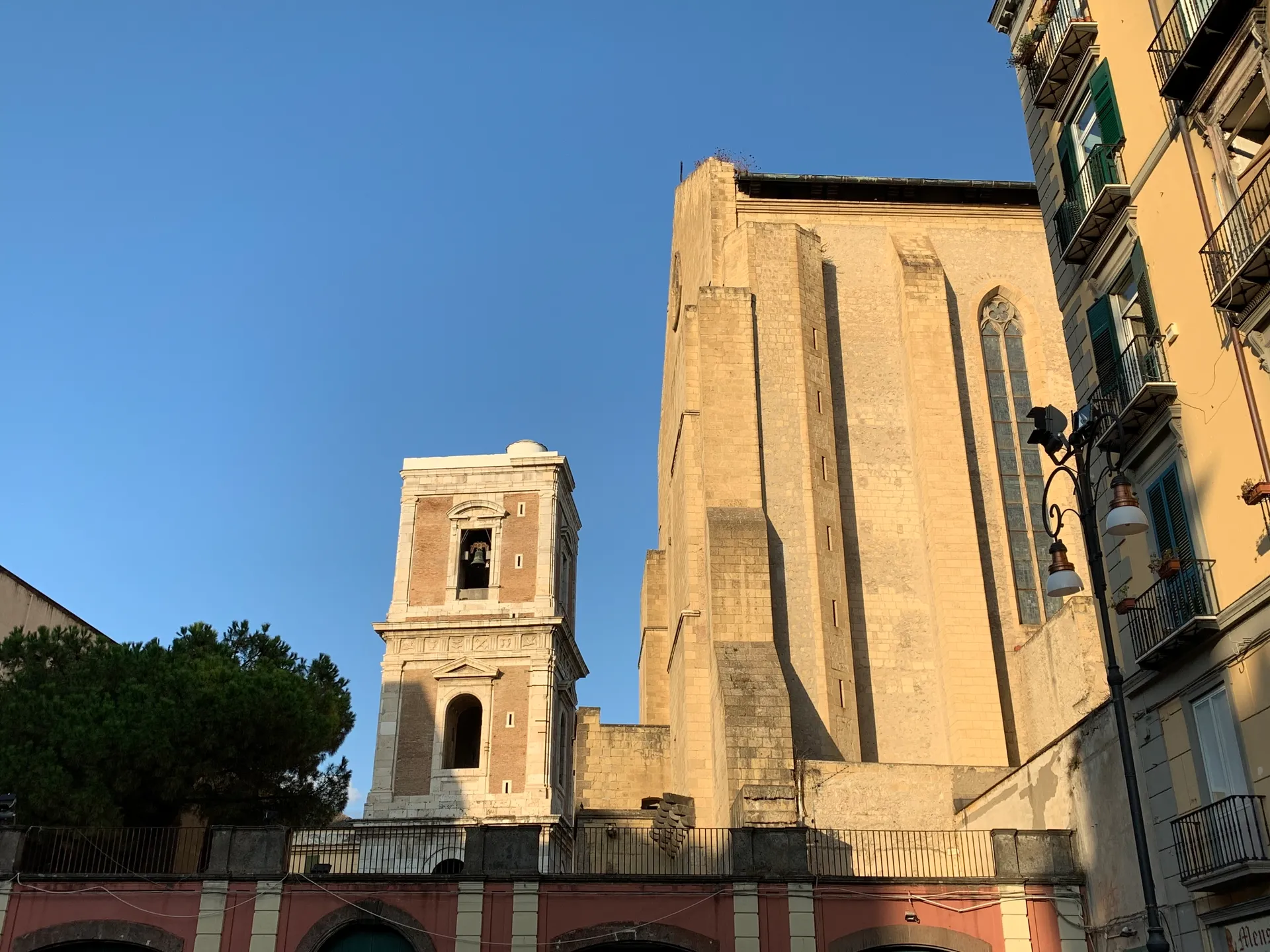 The bell tower of Santa Chiara seen from Piazza del Gesรน Nuovo, Naples