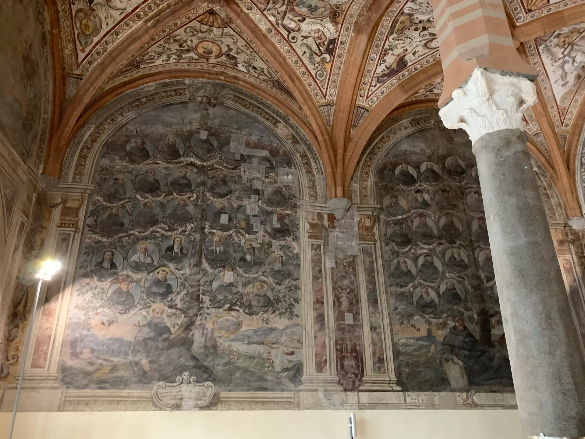 A frescoed chapel with an antique column in the historic centre of Naples