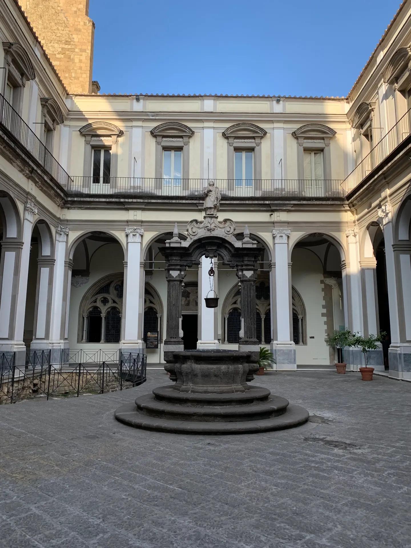 A stone well in the arcaded cloister of San Lorenzo Maggiore, Naples
