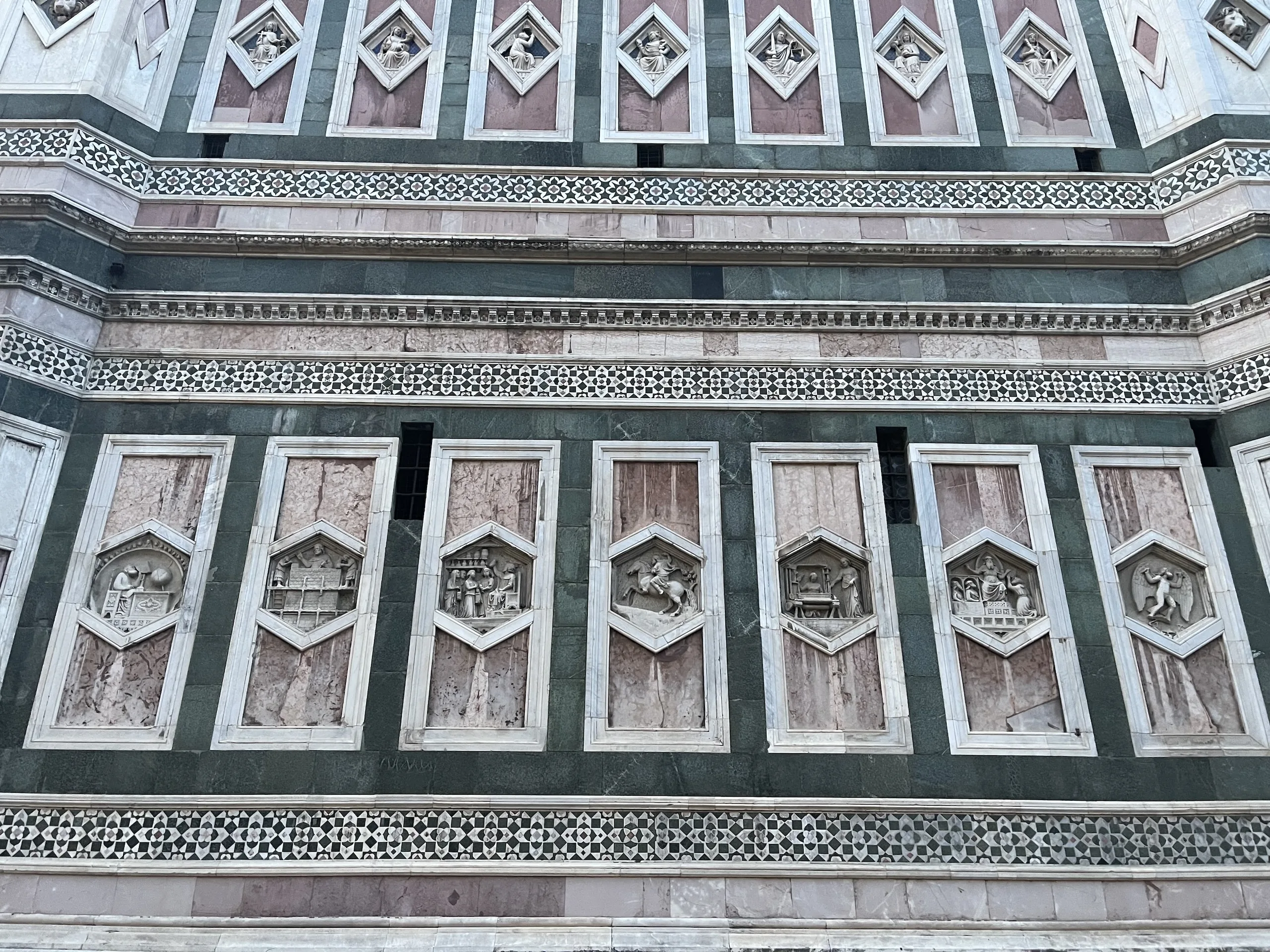 The hexagonal and lozenge relief panels on the lower storeys of Giotto's campanile