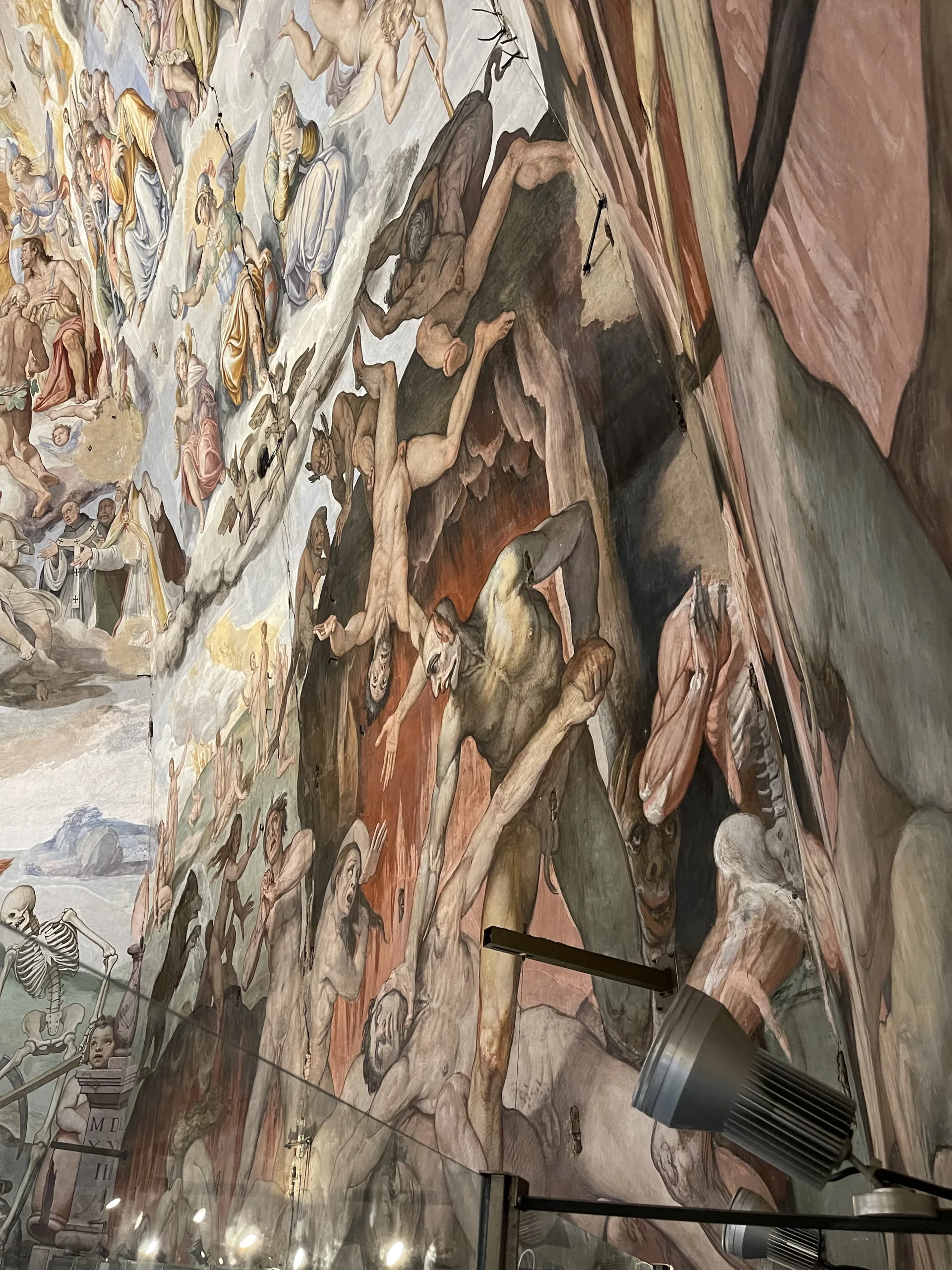 Figures in the Last Judgment fresco at close range from the dome walkway