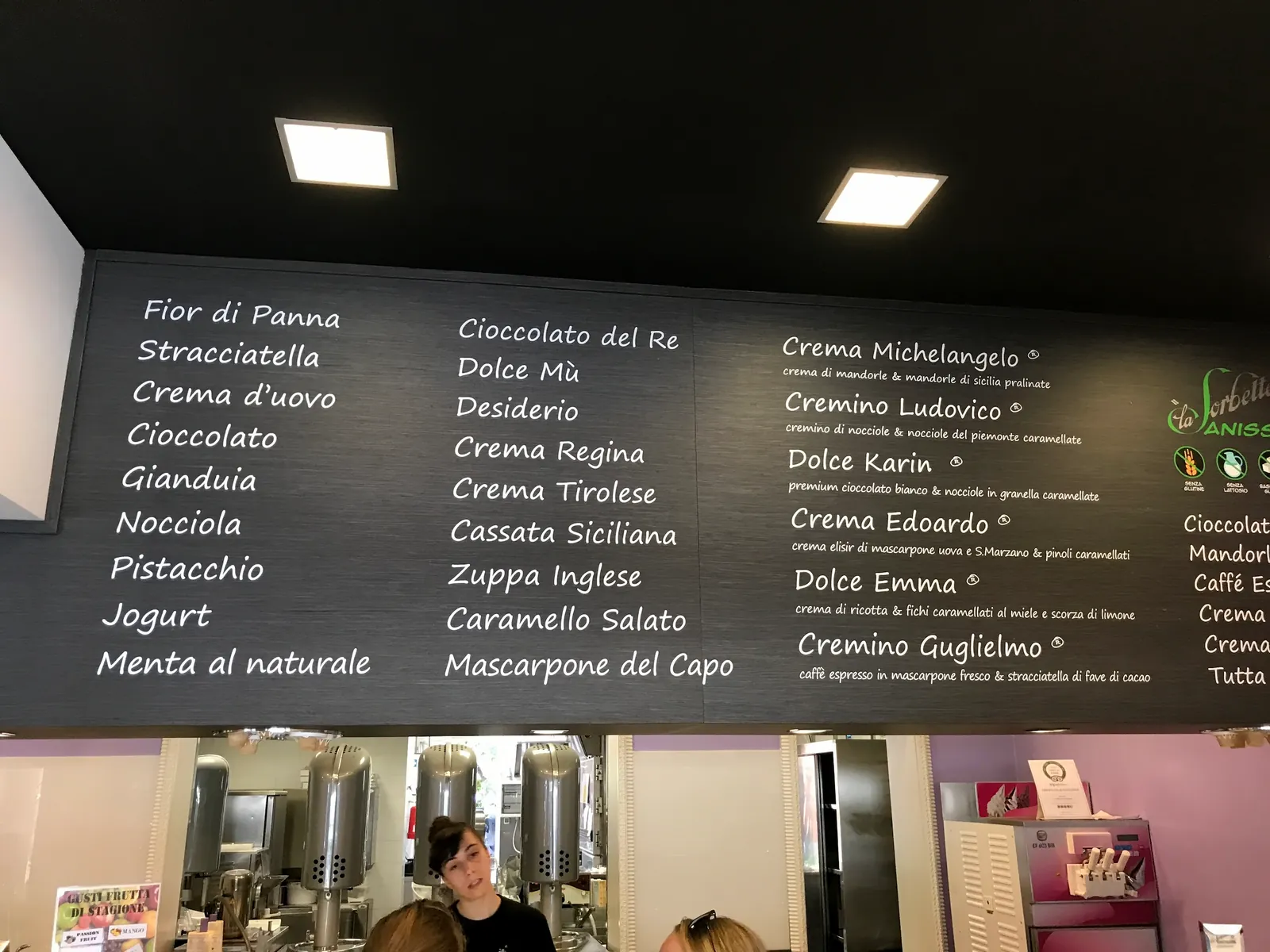 The flavour board at La Sorbetteria Castiglione listing house gelato creams.