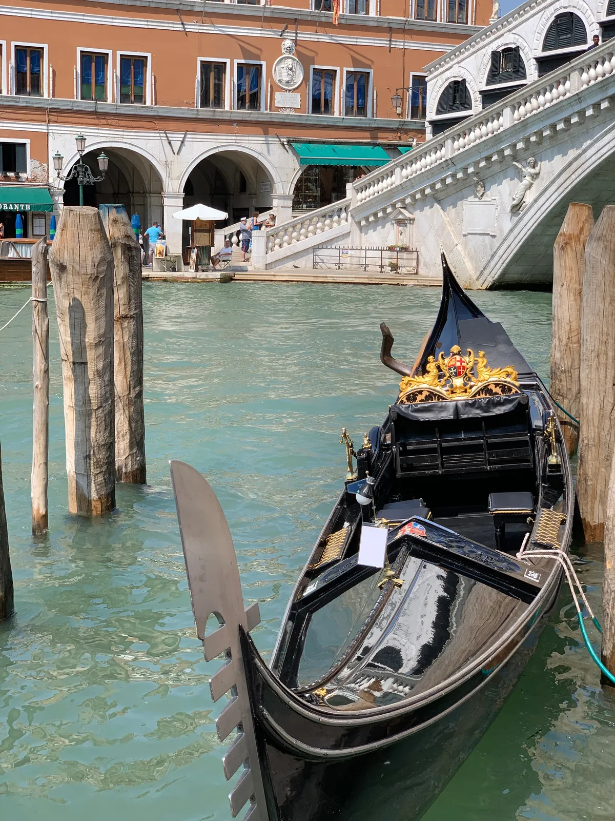 The ornate prow of a Venetian gondola with its brass ferro and seahorse decoration