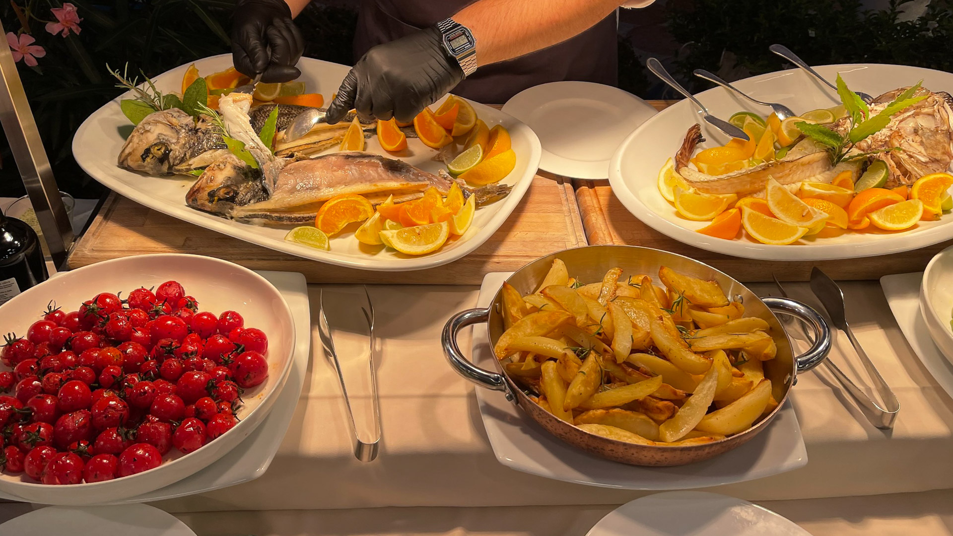 A whole fish carved and deboned tableside in the Grand Hotel Rimini dining room