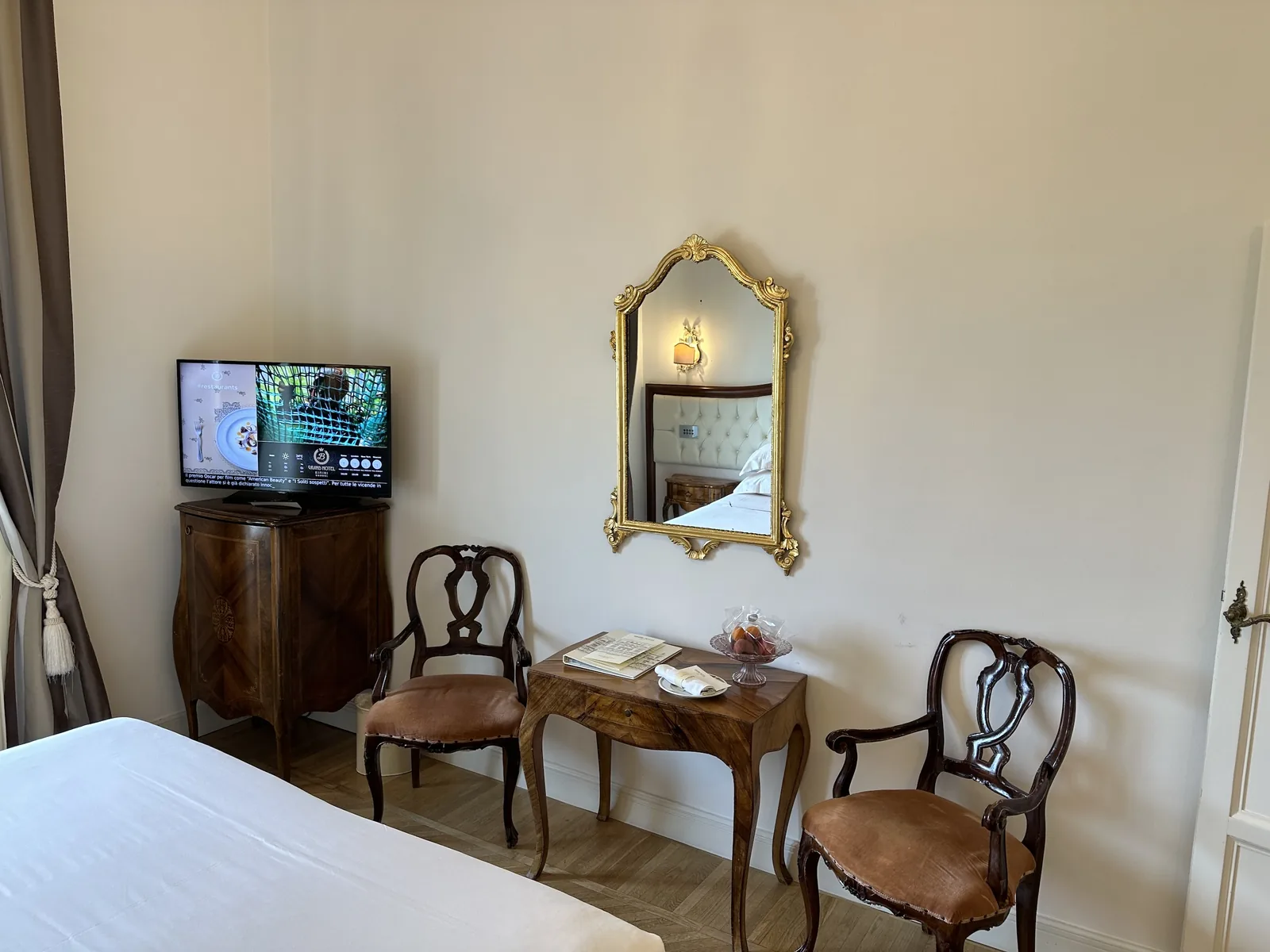 Antique writing table and chairs in a Grand Hotel Rimini guest room