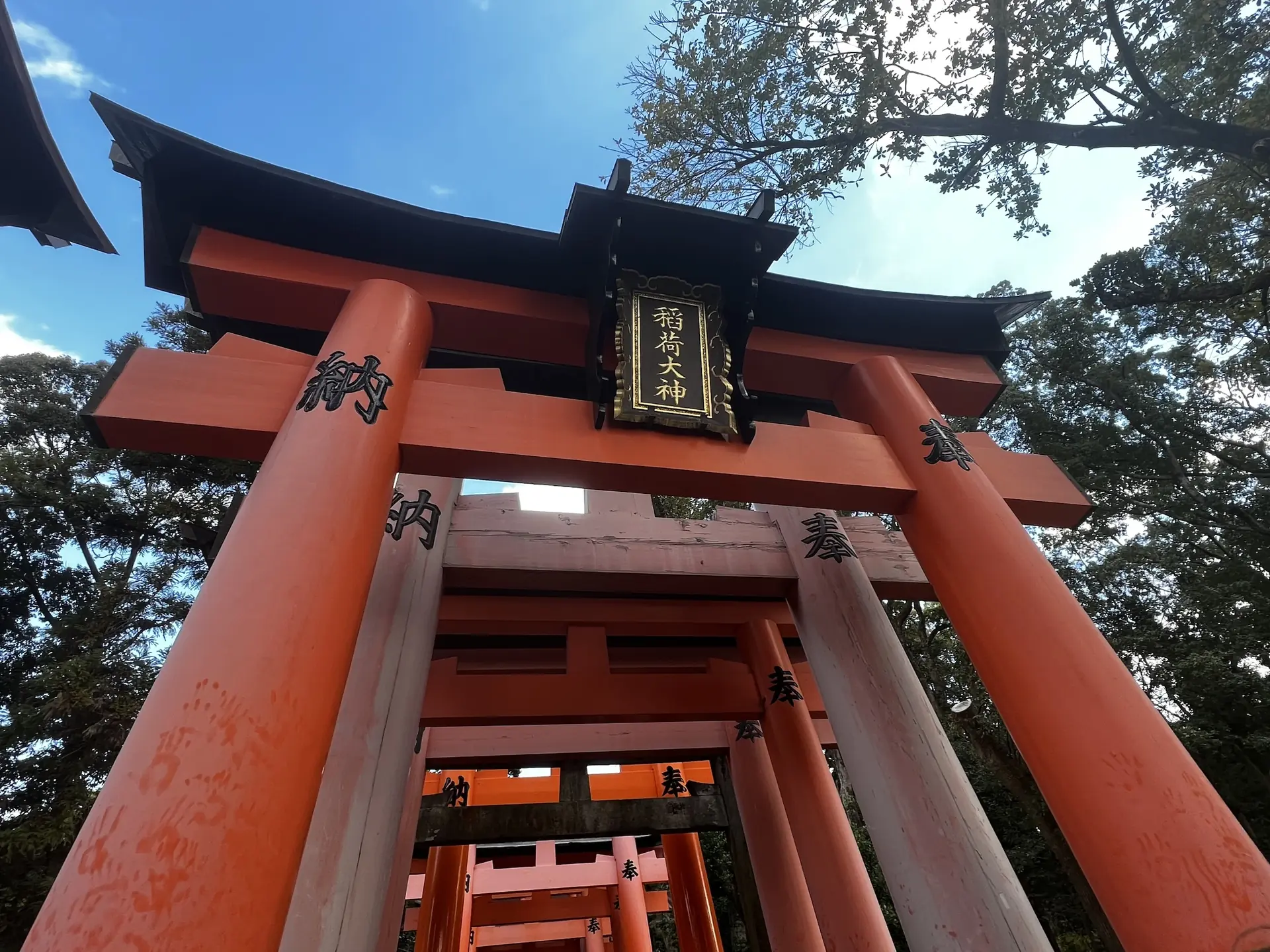 Large vermilion torii gate at the entrance to Fushimi Inari shrine, Kyoto