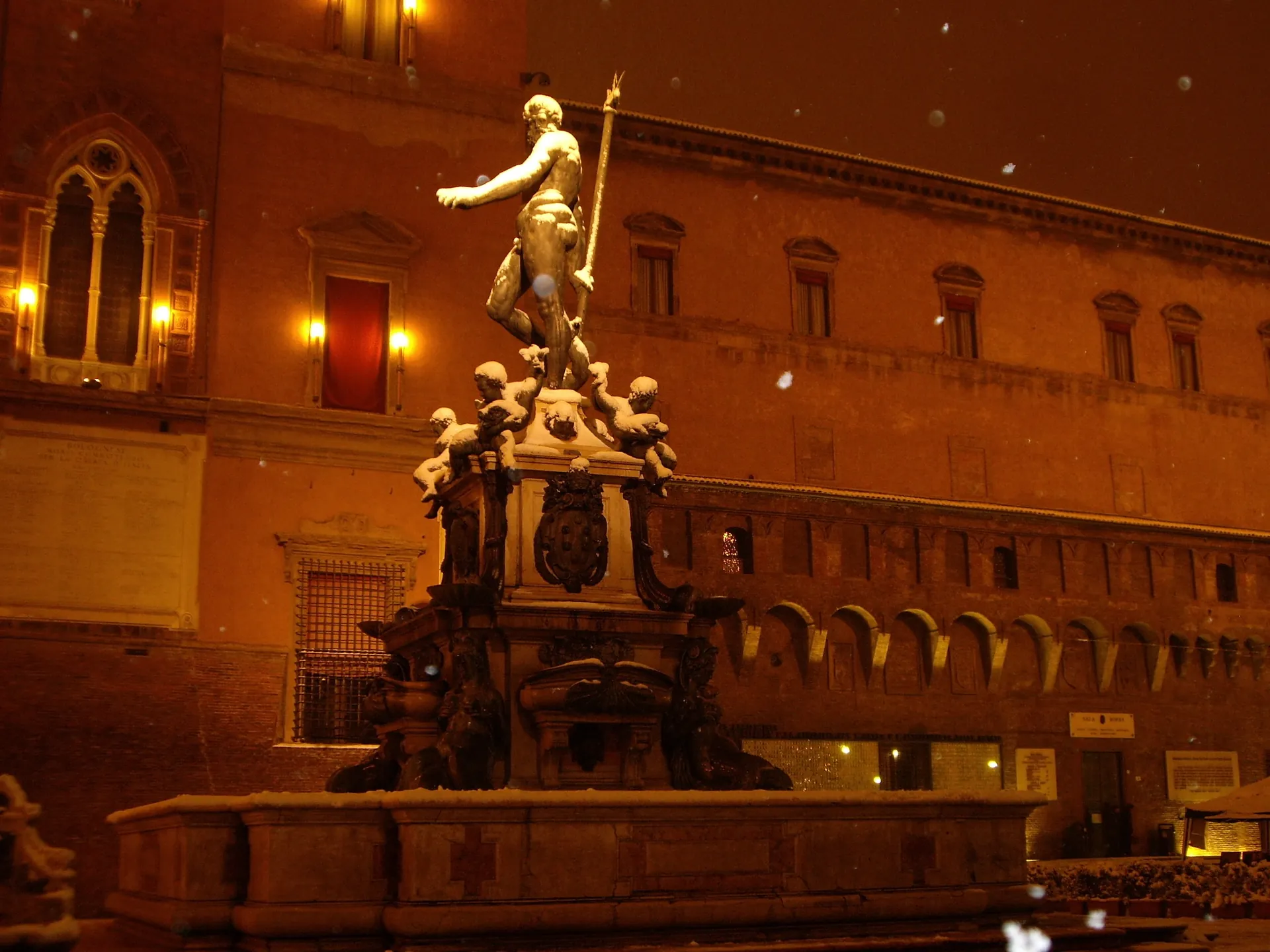 Snow on bronze, lamplight on the arches
