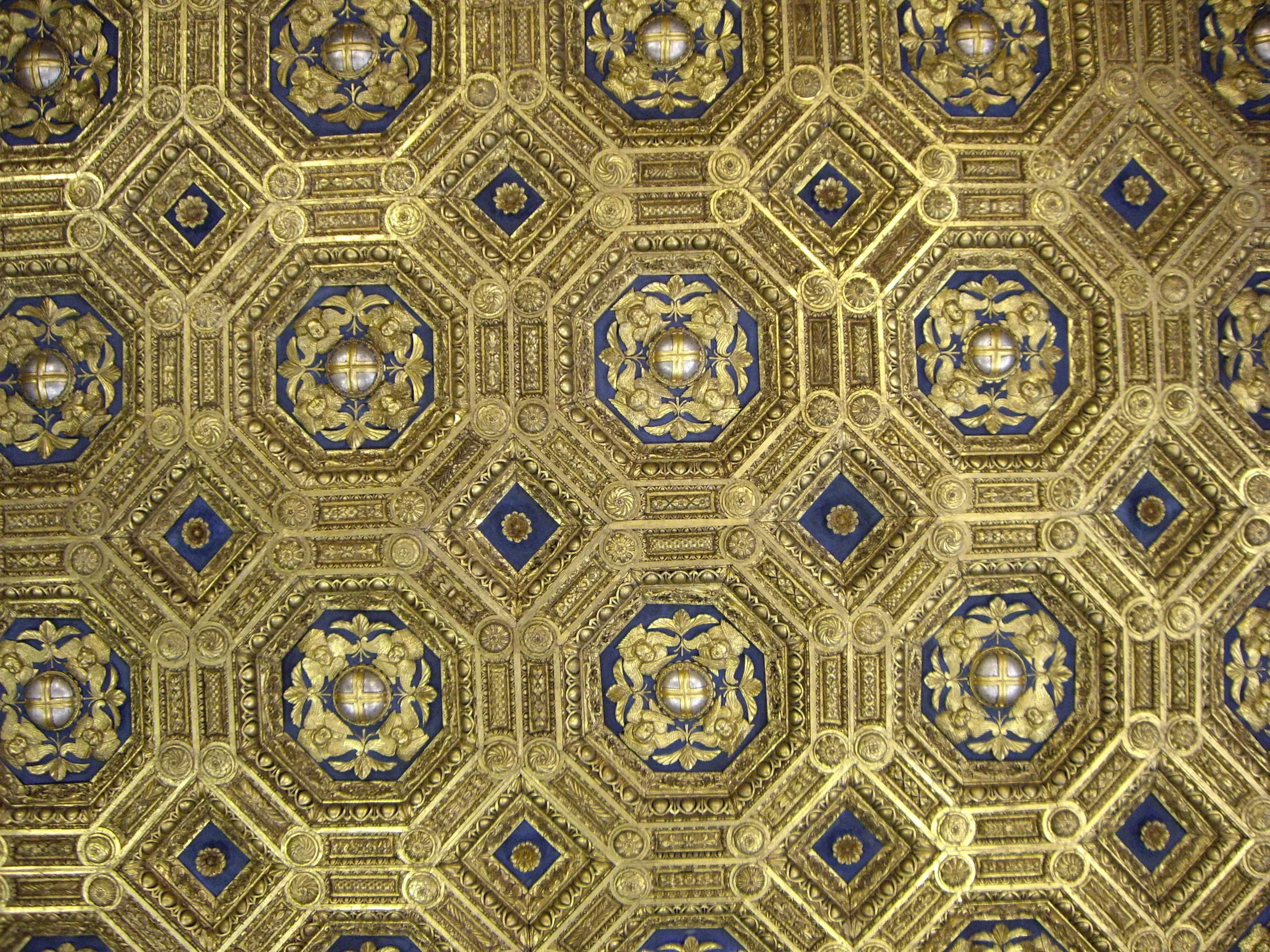 A blue and gold coffered ceiling in the Medici apartments of the Palazzo Vecchio