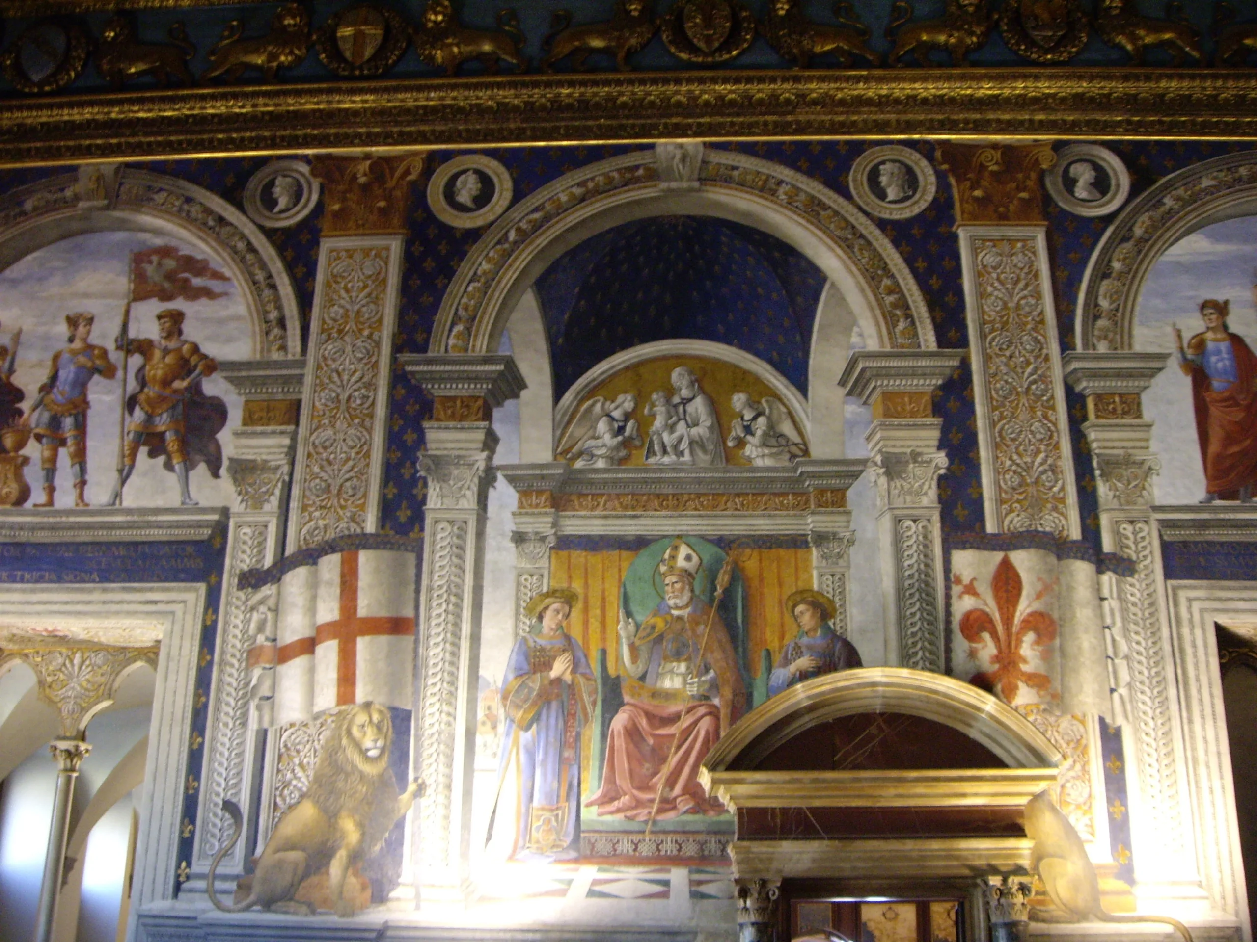 Ghirlandaio's fresco of Saint Zenobius and Roman heroes on the wall of the Sala dei Gigli