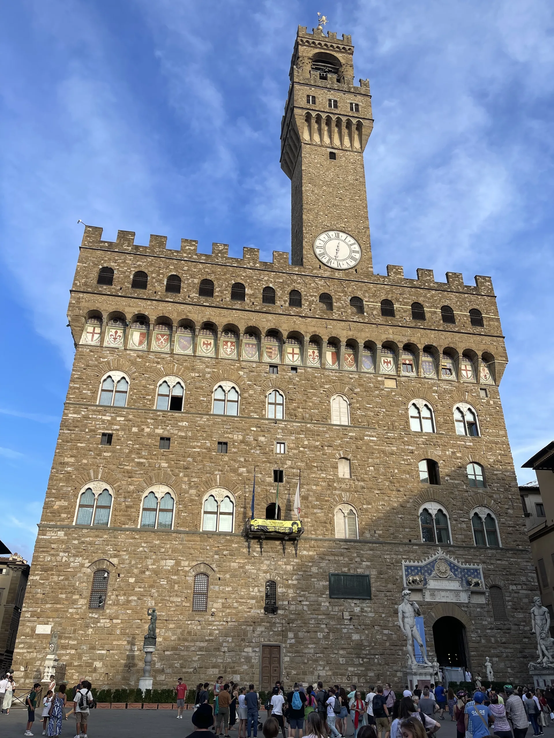 The clock face and belfry of the Torre di Arnolfo on the Palazzo Vecchio