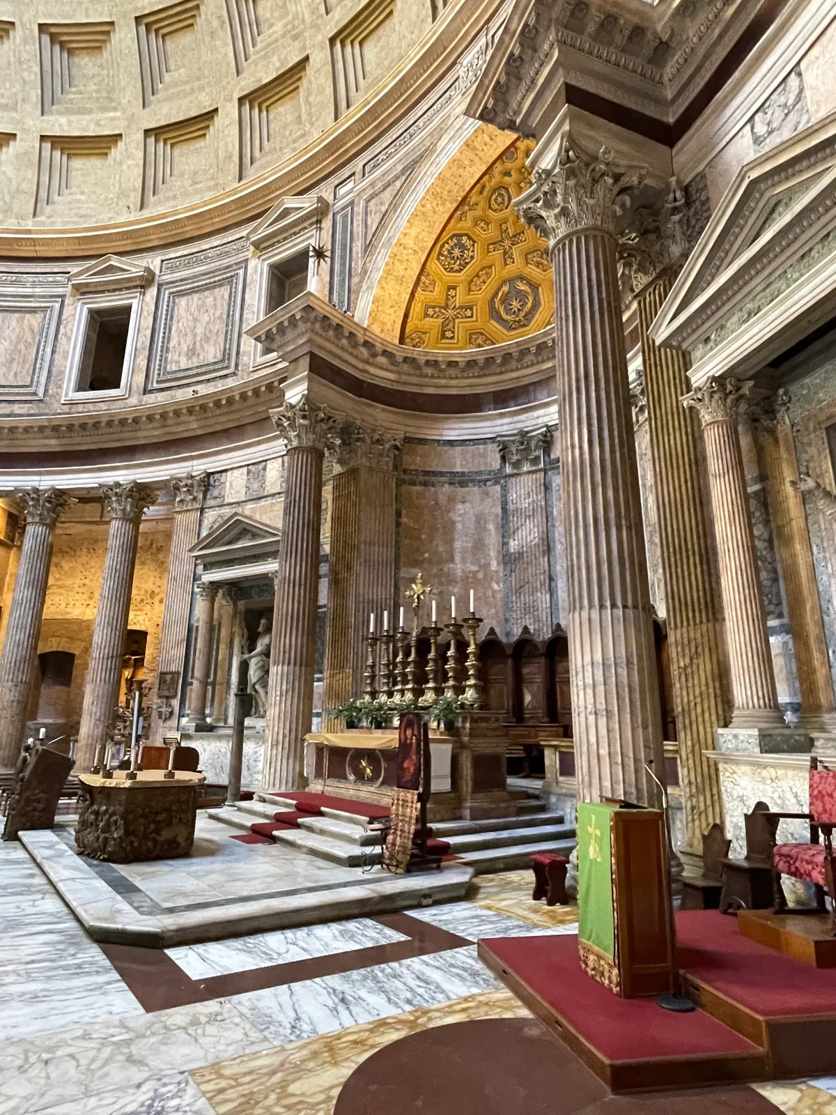 Side view of the Pantheon high altar with fluted Corinthian columns and the dome above
