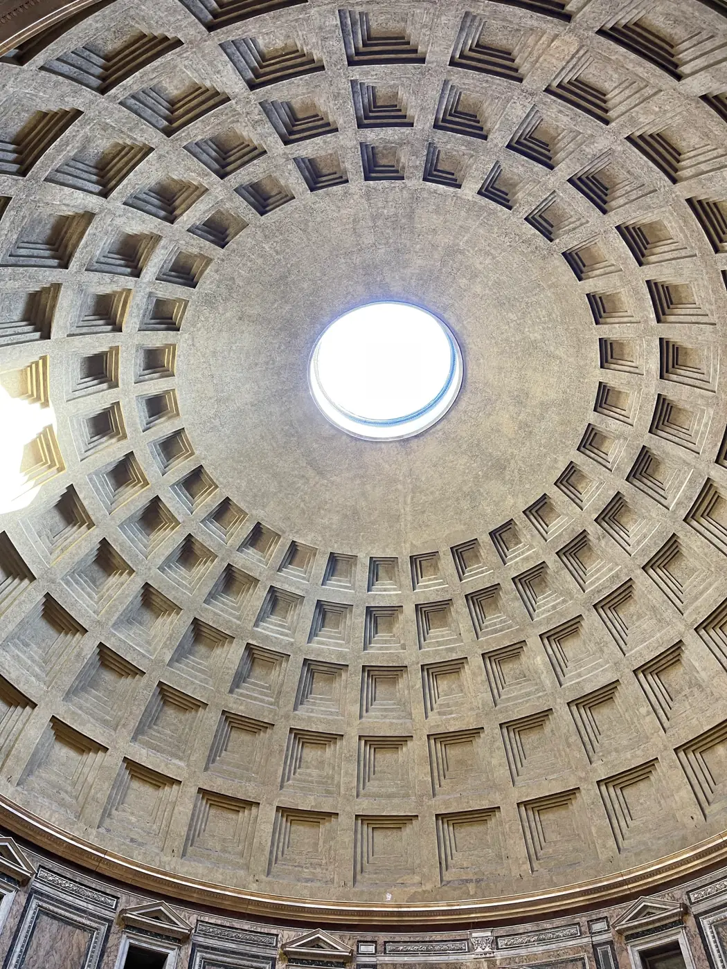 The coffered ceiling of the Pantheon dome centered on the open oculus