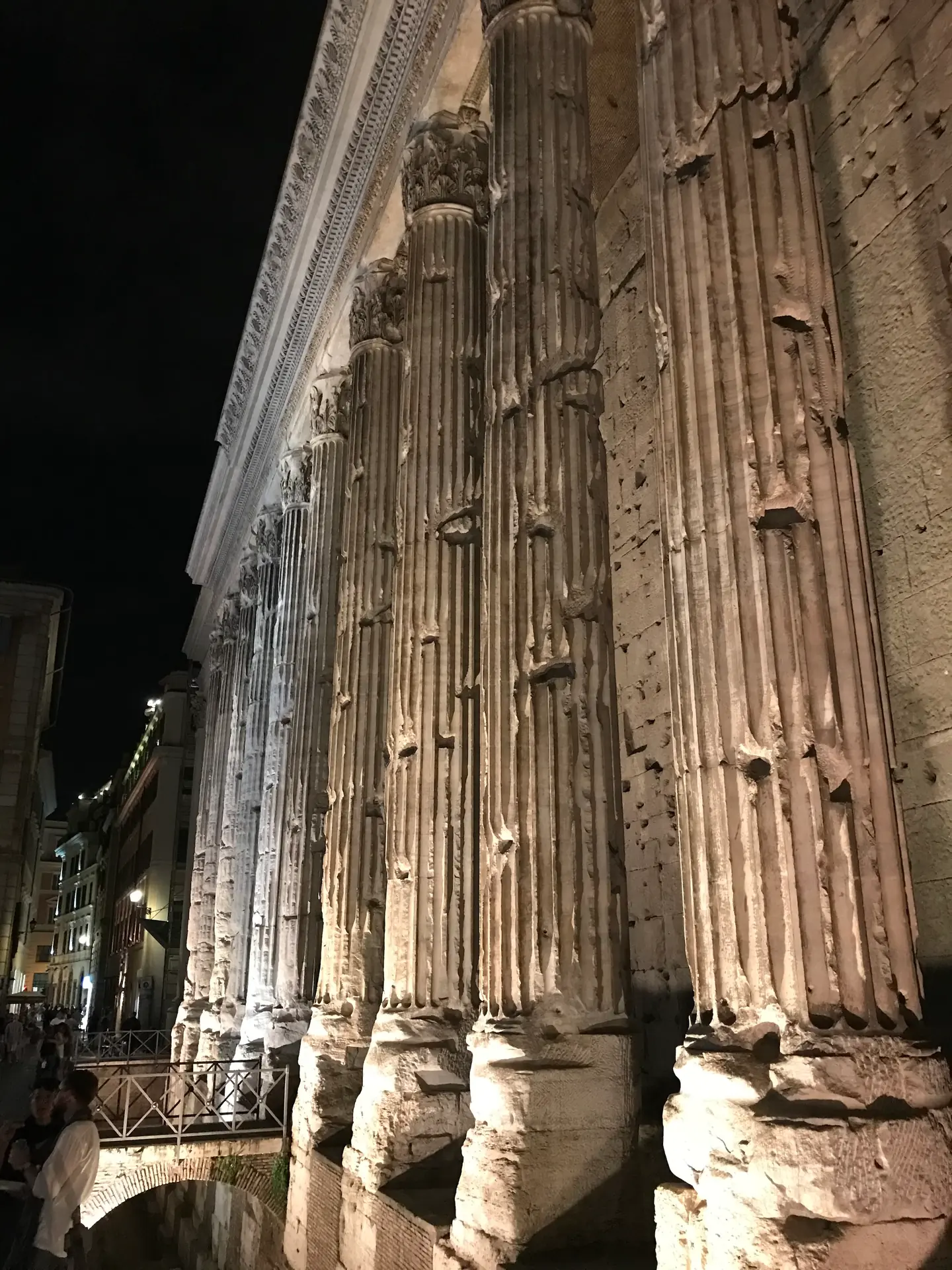 Floodlit columns of the Temple of Hadrian in Piazza di Pietra at night