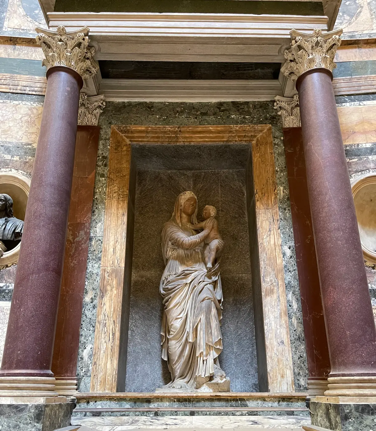 Lorenzetto's Madonna del Sasso statue in a marble niche above Raphael's tomb