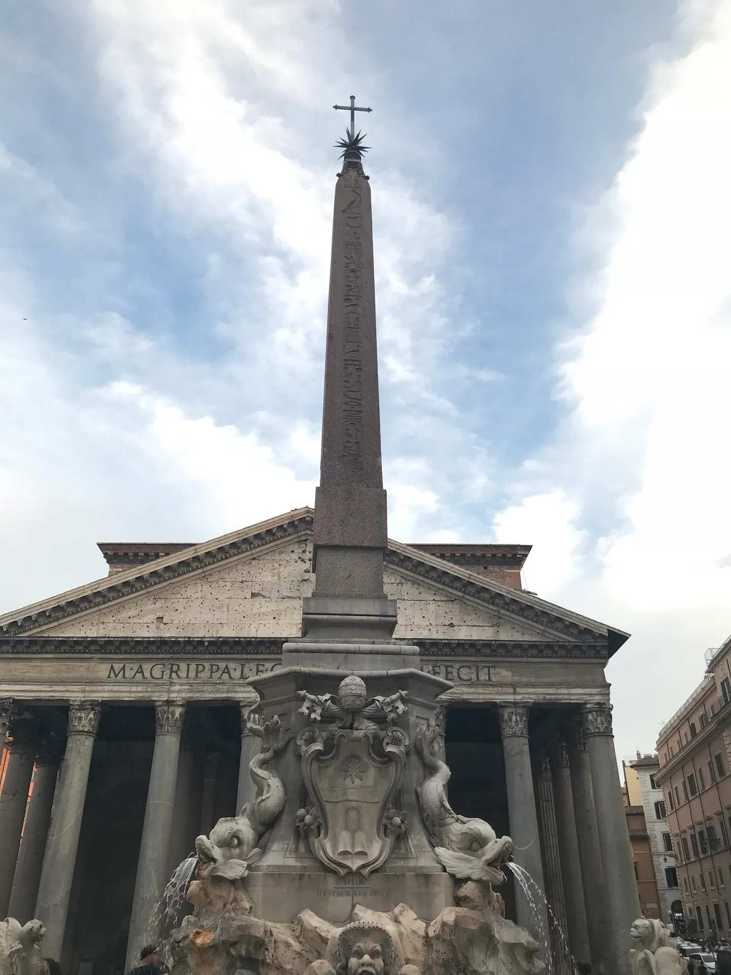 Obelisk and fountain of Piazza della Rotonda rising in front of the Pantheon pediment