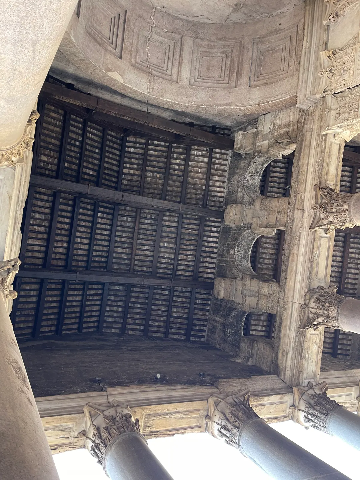 Timber ceiling of the Pantheon portico above Corinthian column capitals