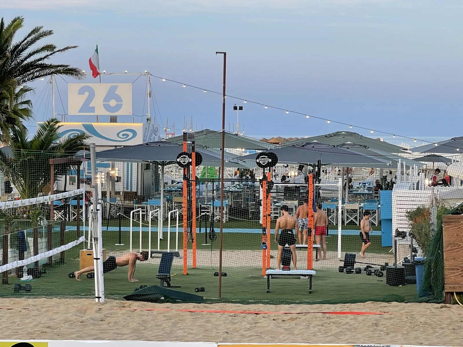 Open-air fitness area with calisthenics rigs on Rimini's seafront promenade