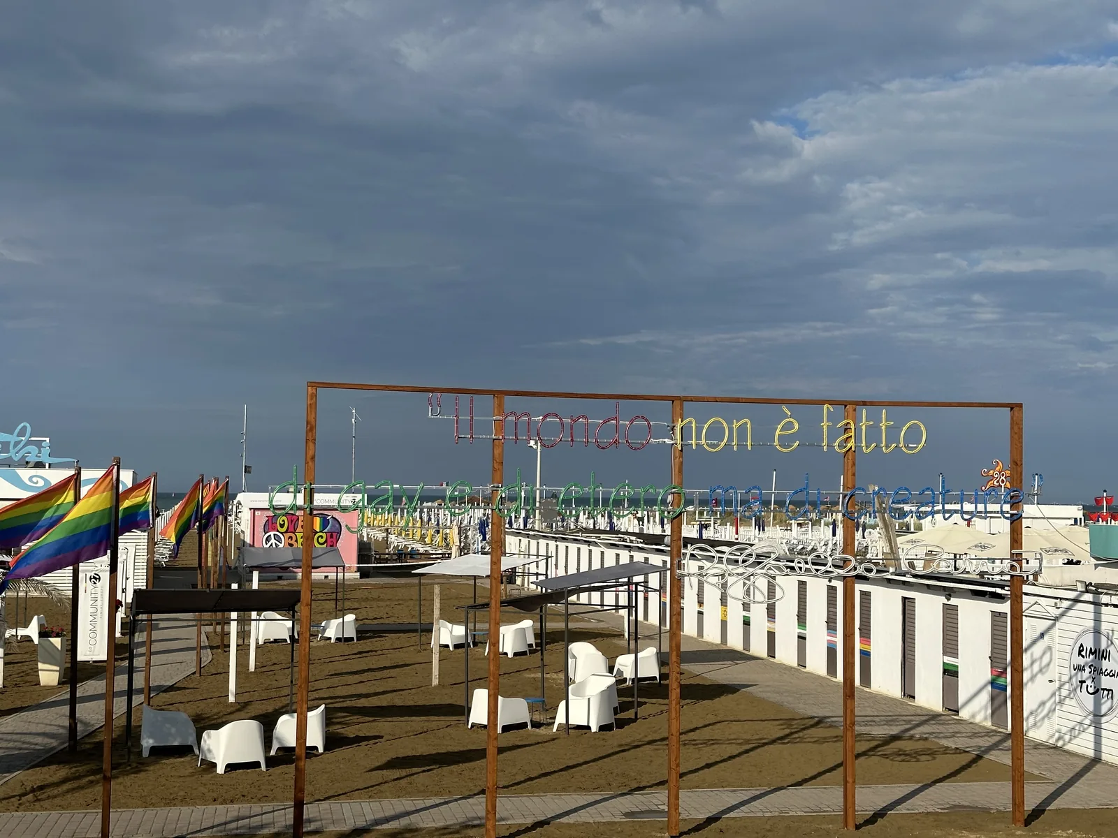 Beach club with rainbow flags on the Rimini seafront, una spiaggia per tutti