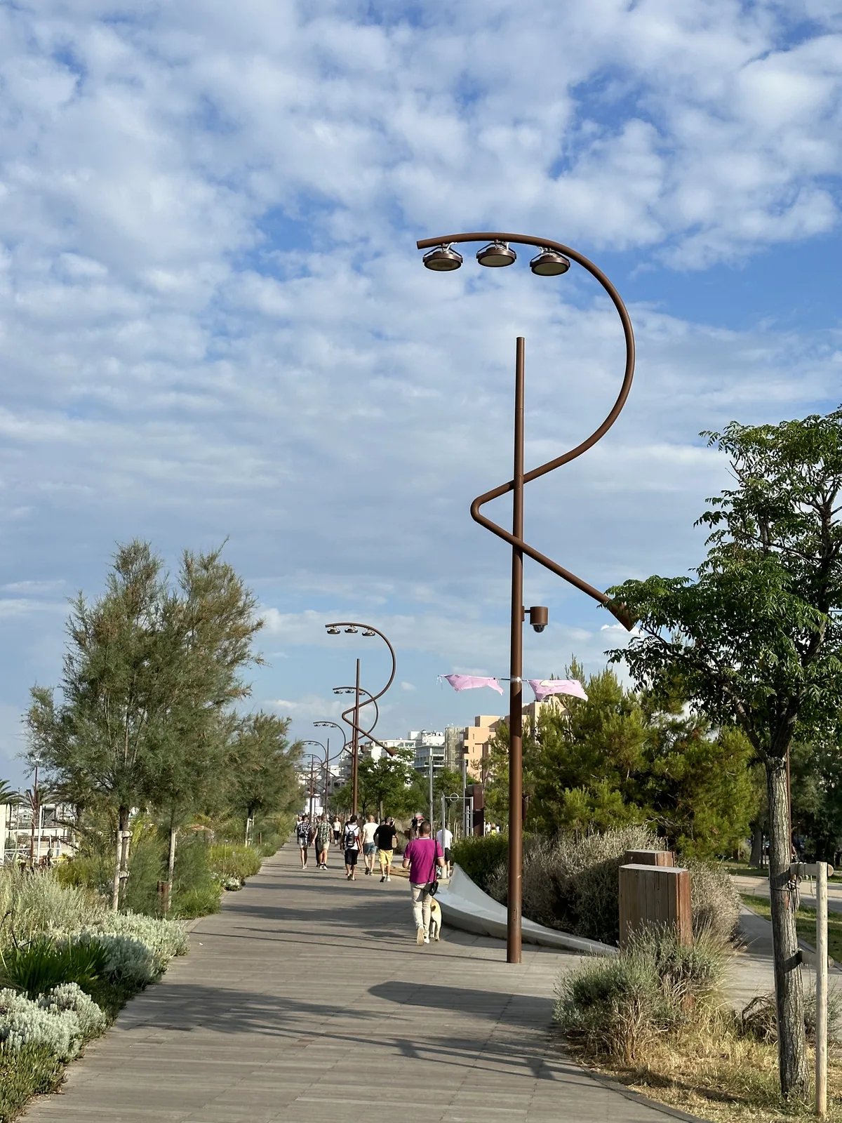 Boardwalk and a sculptural curved lamppost on Rimini's Parco del Mare promenade