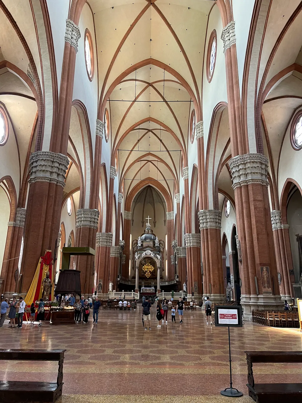 The tall vaulted nave of San Petronio basilica seen from the entrance.
