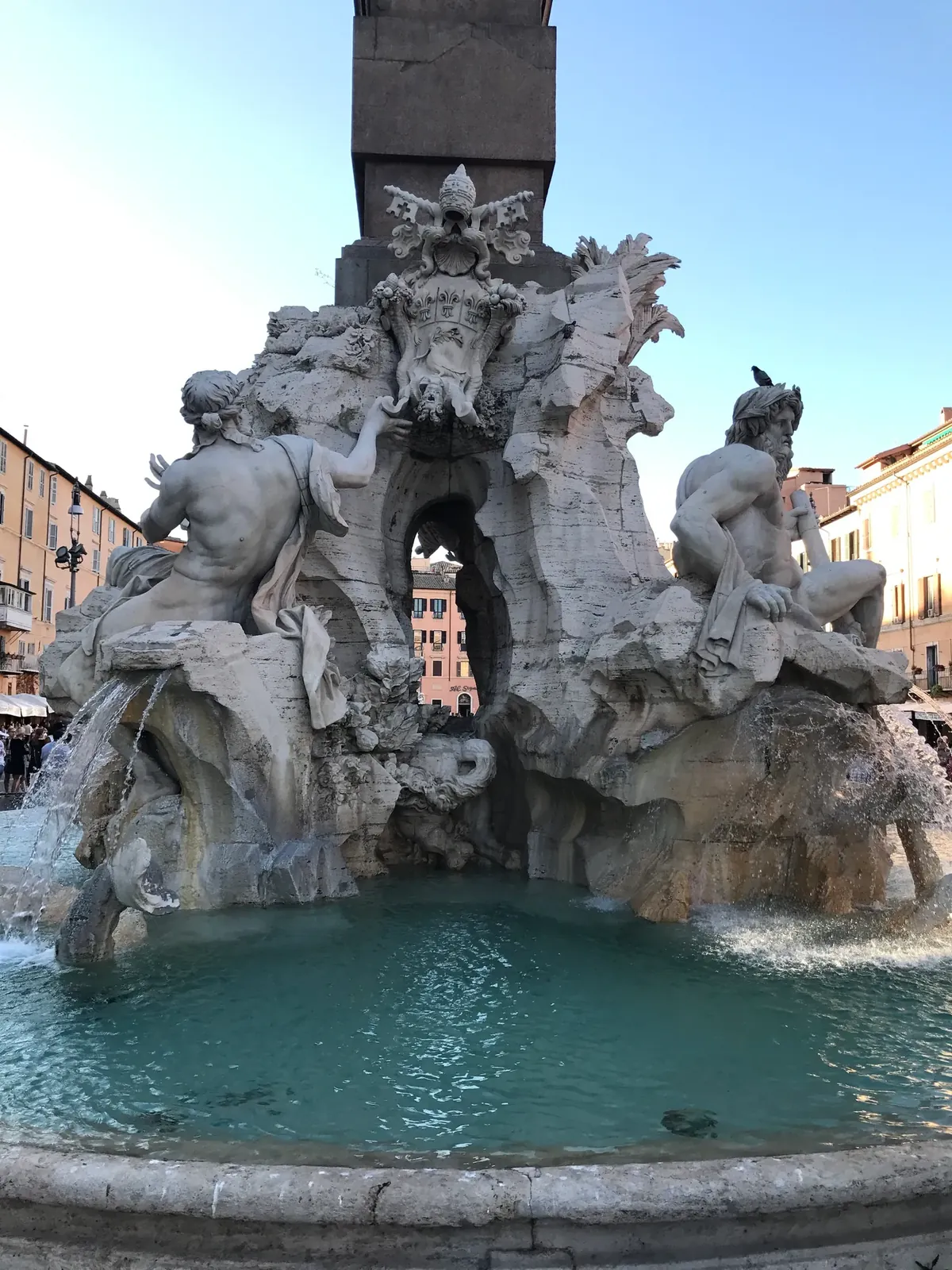 Papal coat of arms with the Pamphili dove carved on the Four Rivers fountain