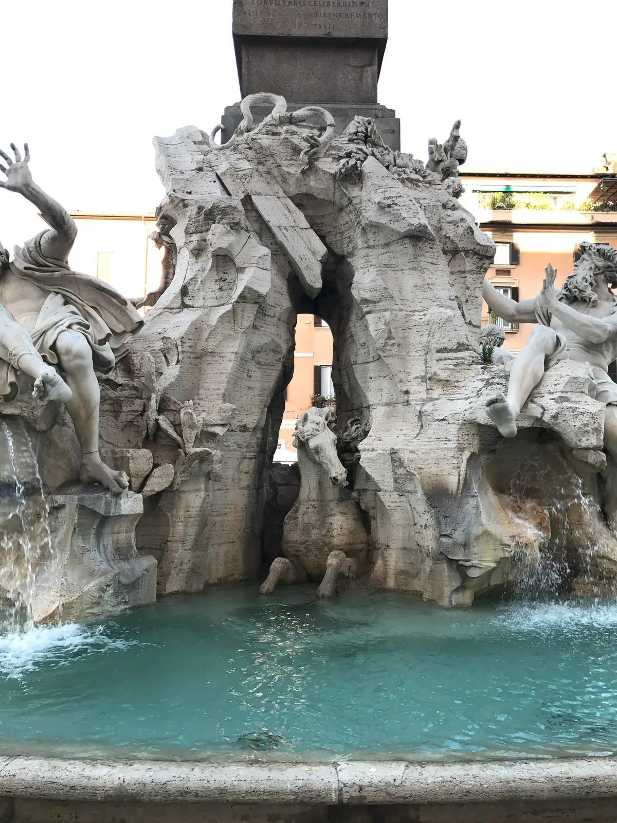 Marble horse emerging from the grotto of the Fountain of the Four Rivers