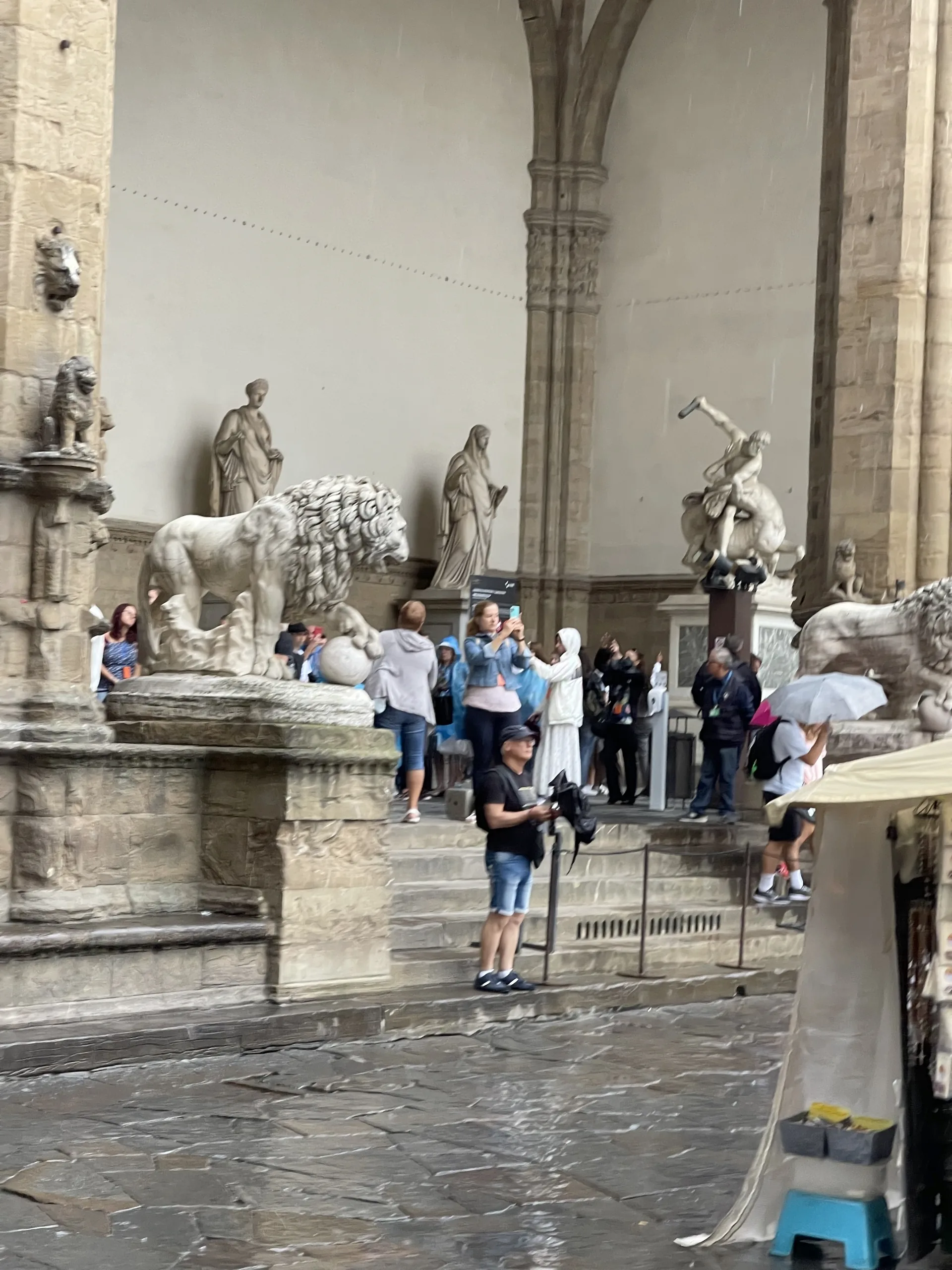 Marble sculpture groups standing under the vaults of the Loggia dei Lanzi