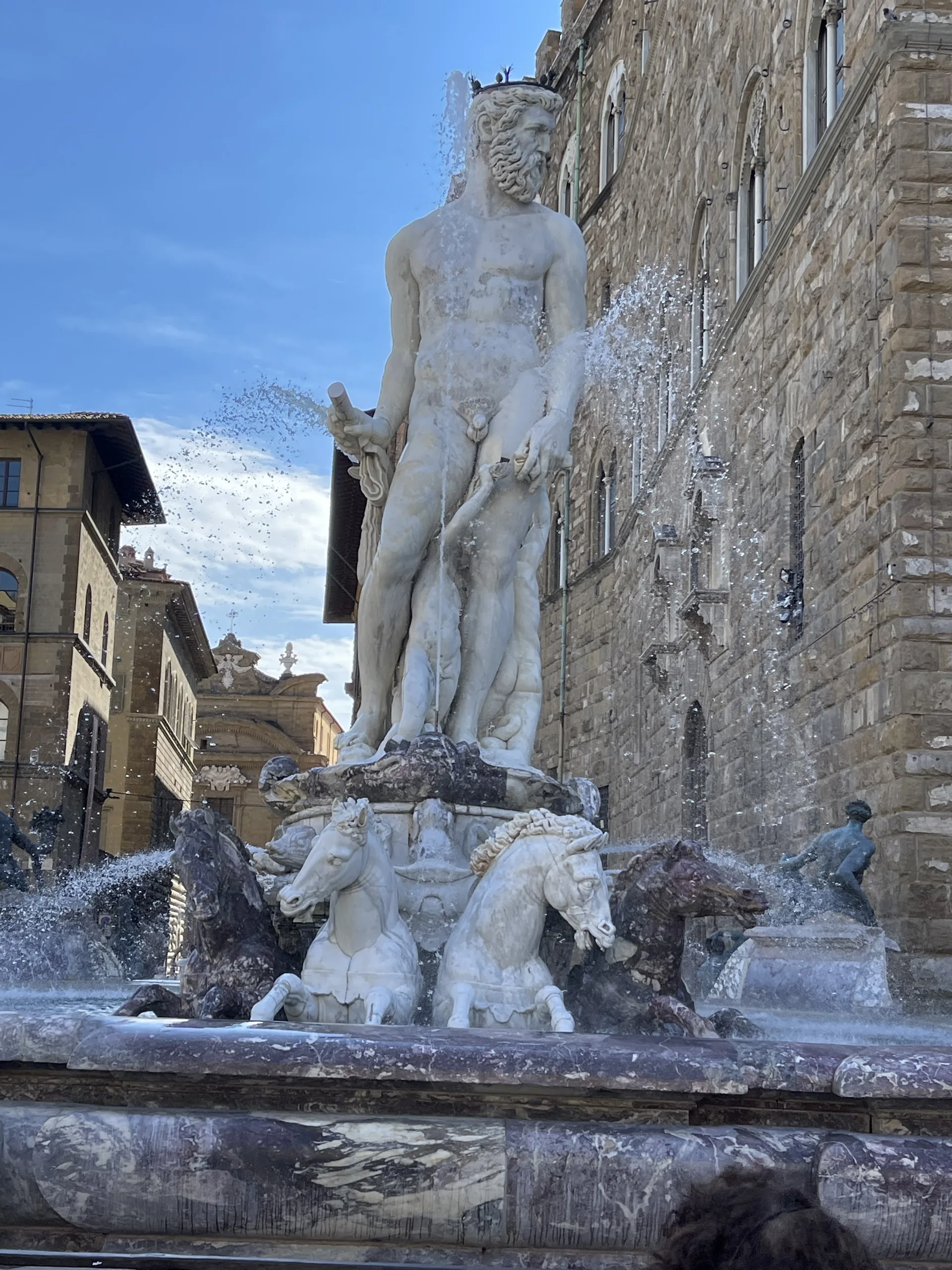 Ammannati's marble Neptune standing over his fountain on Piazza della Signoria