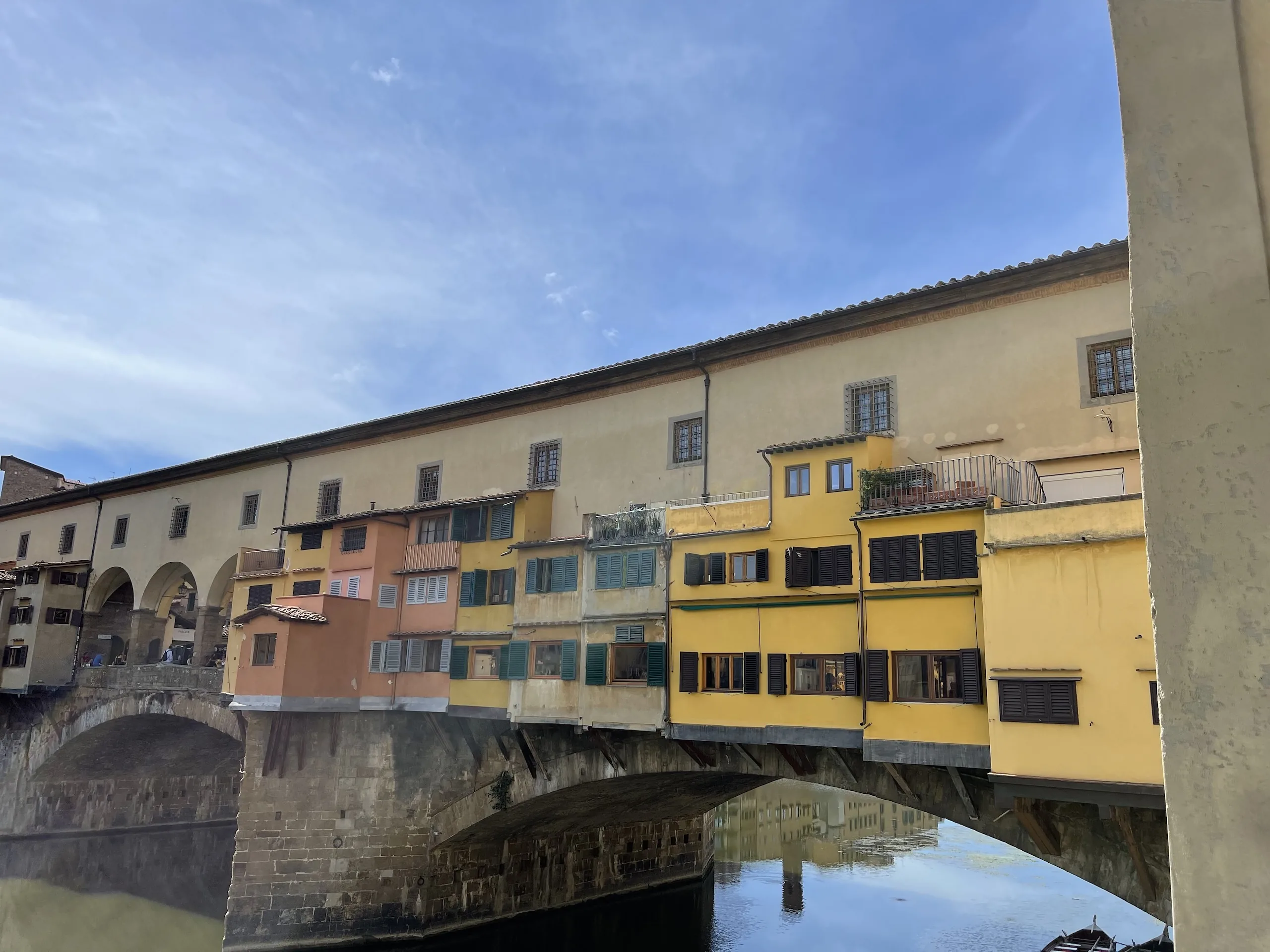 The long flank of the Ponte Vecchio with the Vasari Corridor running above the shops