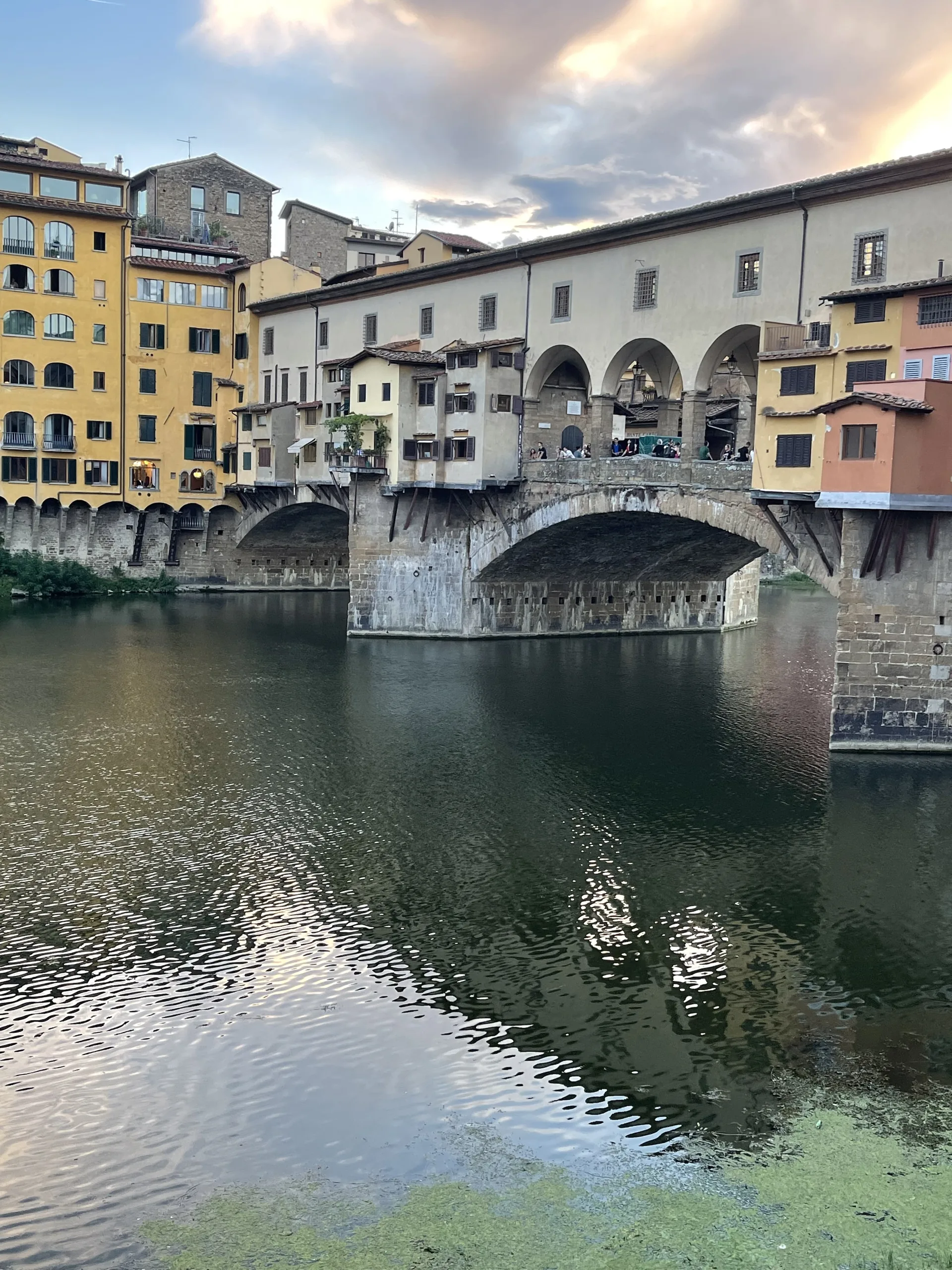 Evening light breaking on the Arno beside the Ponte Vecchio