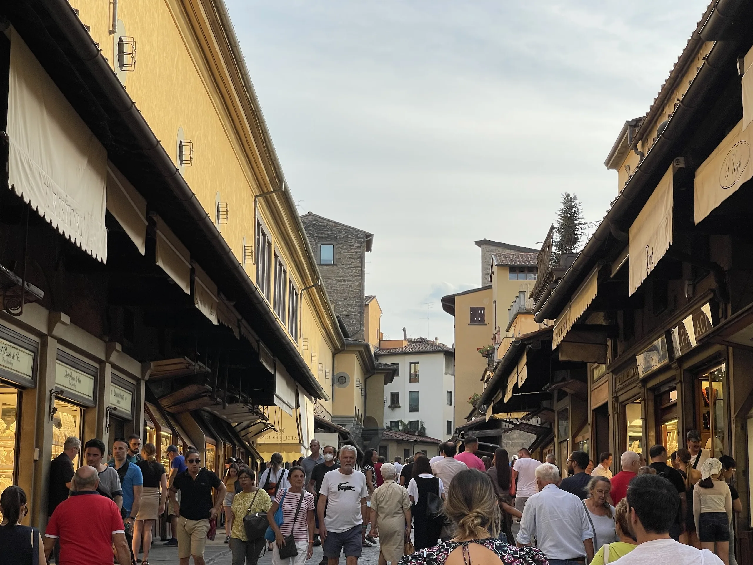 The open arched terrace at the middle of the Ponte Vecchio where the shops break