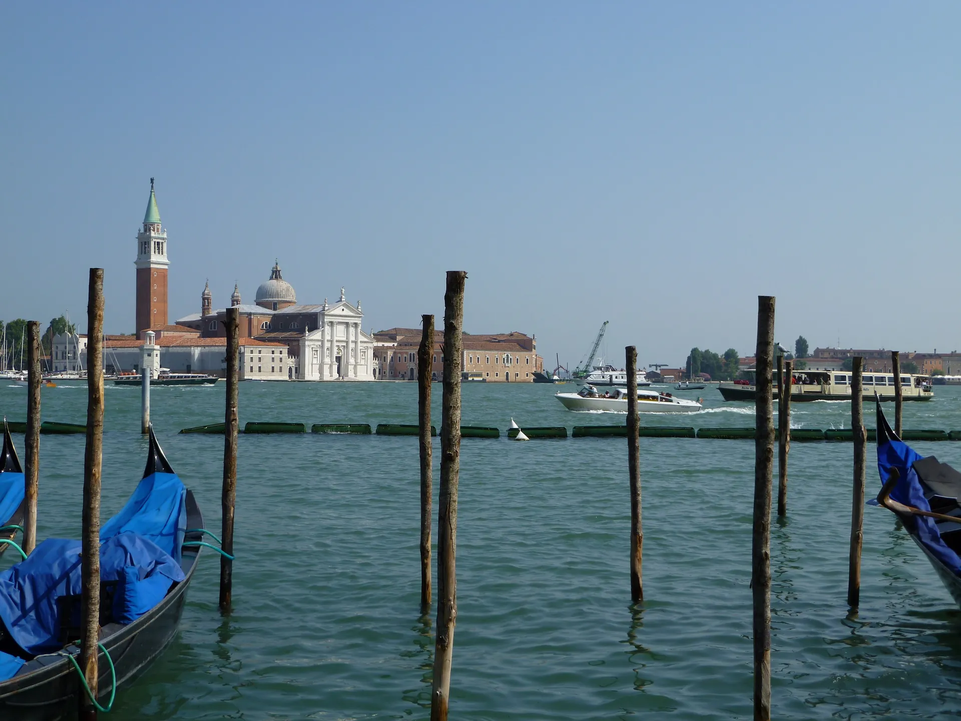 A wide view of San Giorgio Maggiore across the lagoon under a blue sky