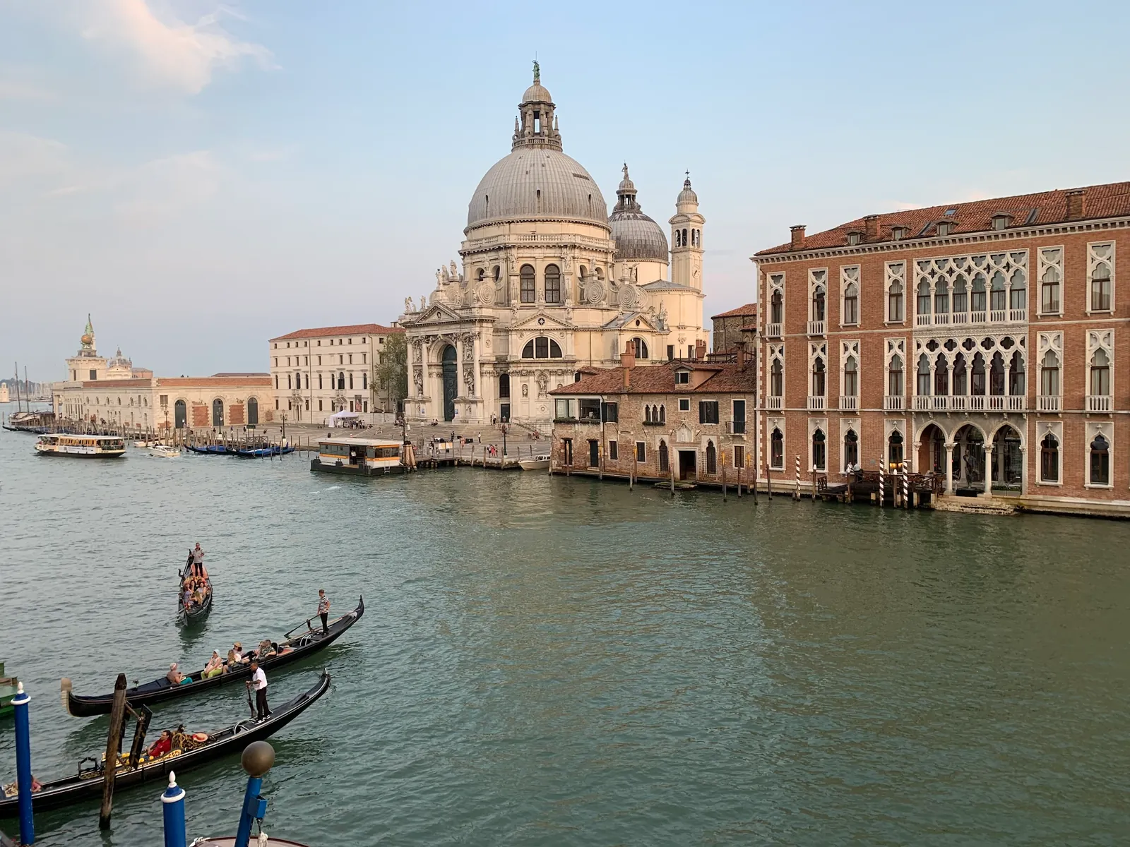 Santa Maria della Salute at golden hour with gondolas on the Grand Canal