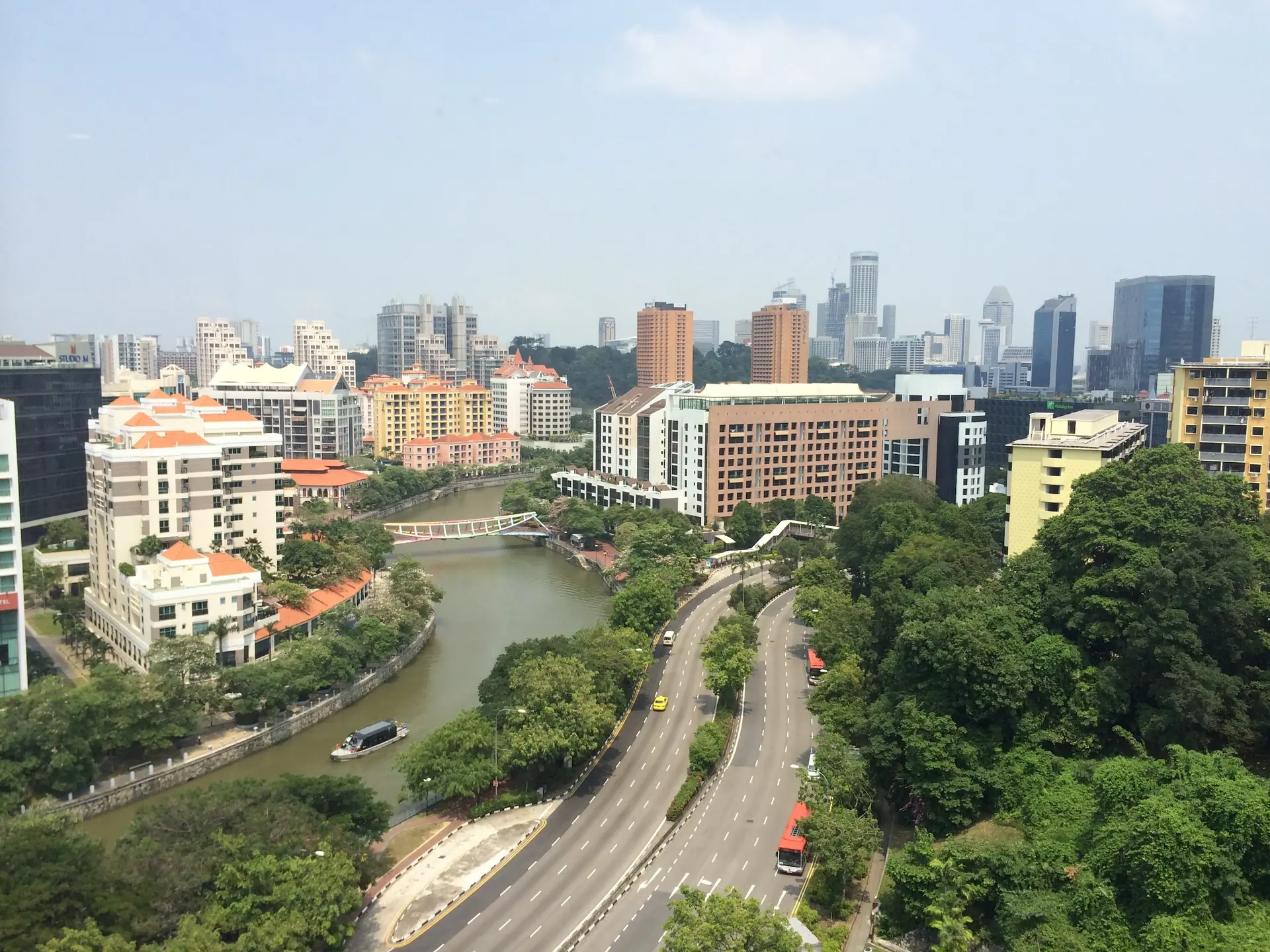 The Singapore River winding past low-rise districts toward the downtown skyline