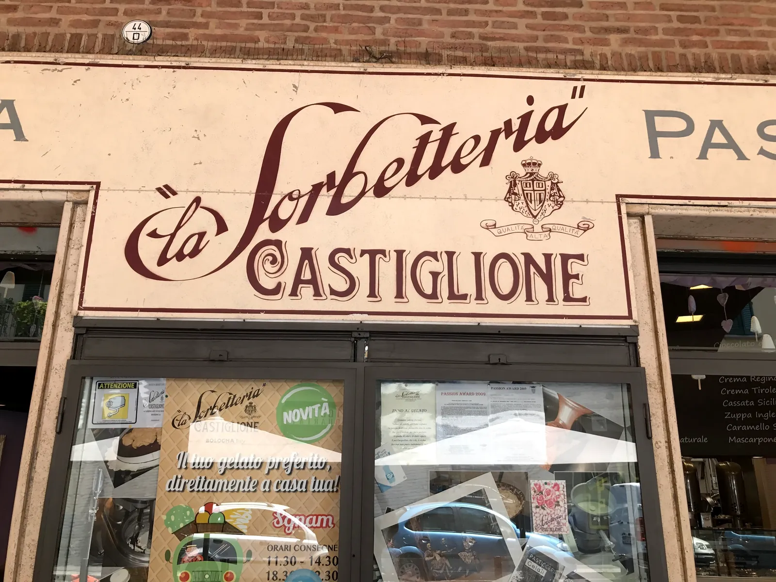 The vintage hand-painted sign of La Sorbetteria Castiglione in Bologna.
