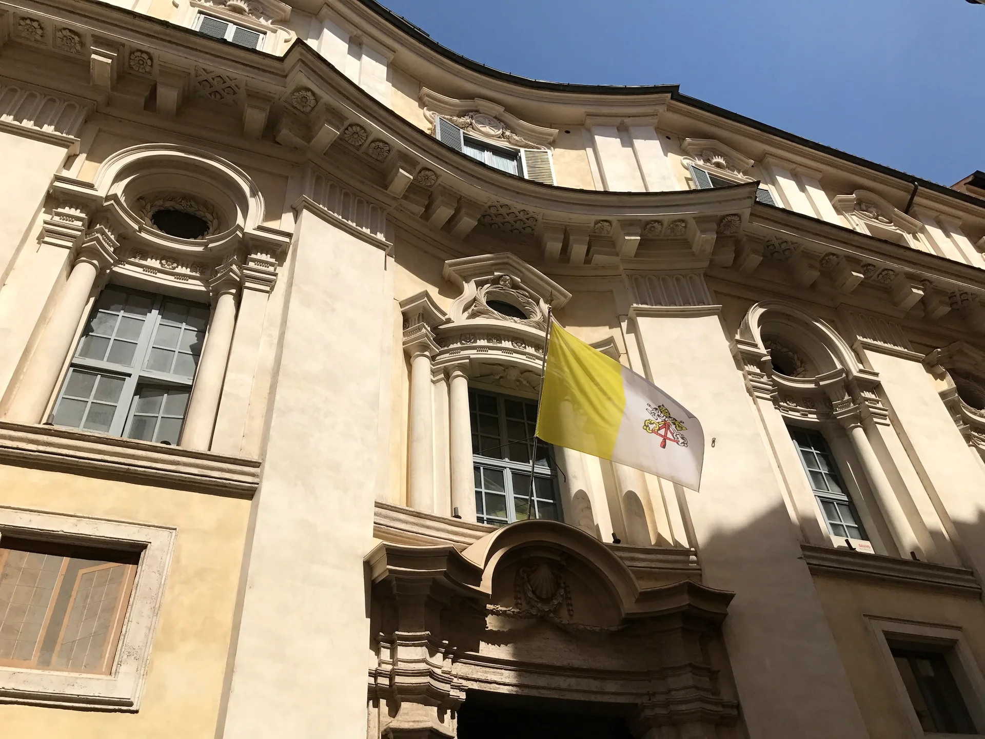 Baroque palazzo with a papal flag on Piazza di Spagna.