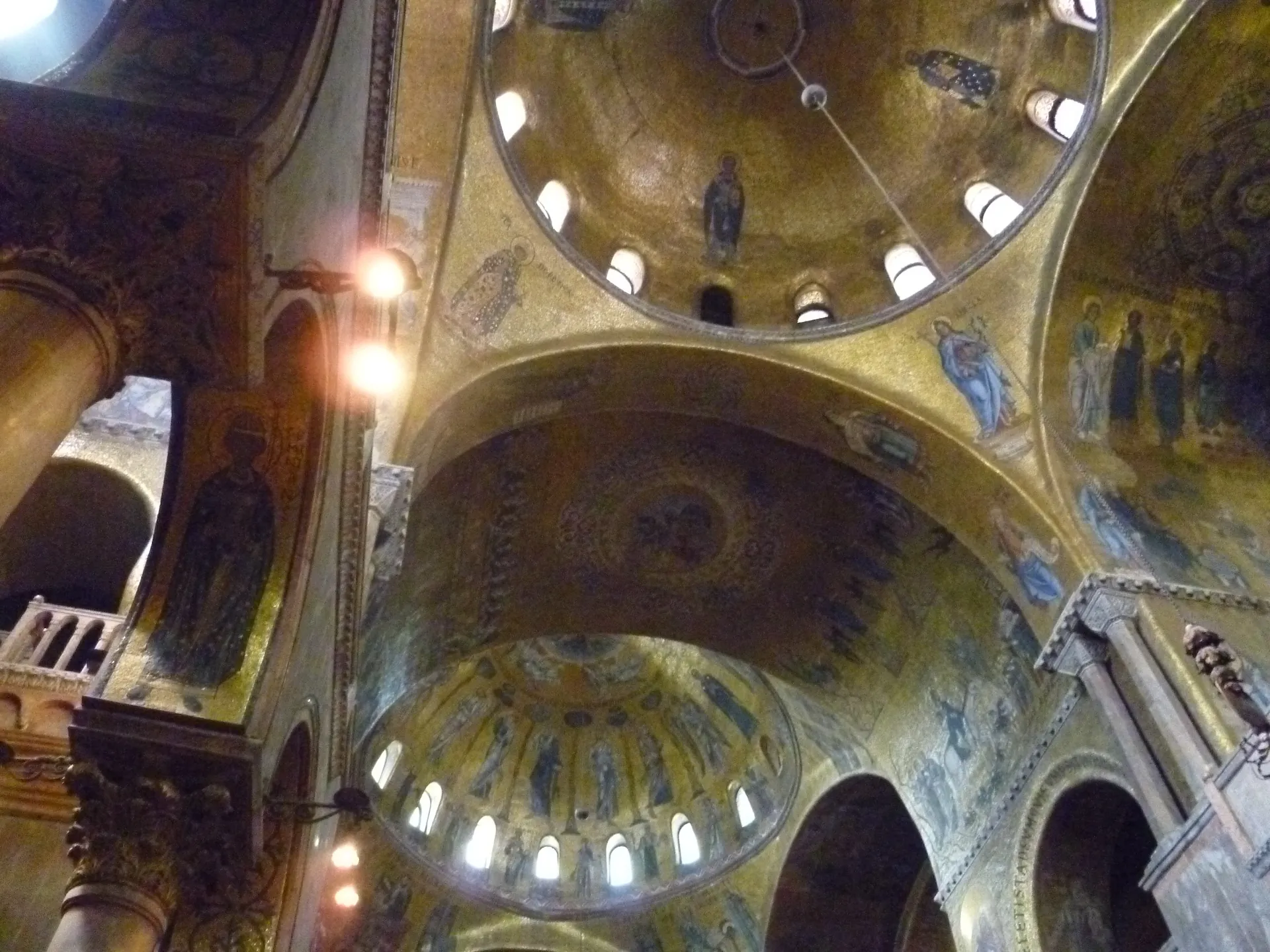 Interior golden dome of St Mark's Basilica covered in Byzantine mosaic