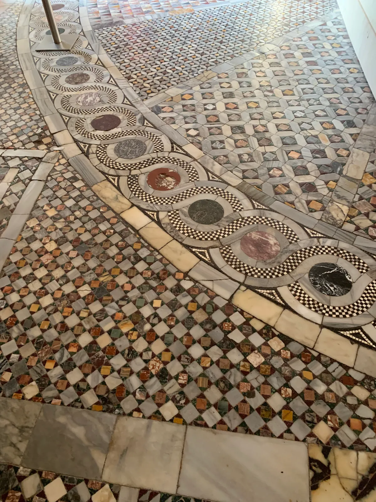 Inlaid geometric marble floor of St Mark's Basilica in coloured stone
