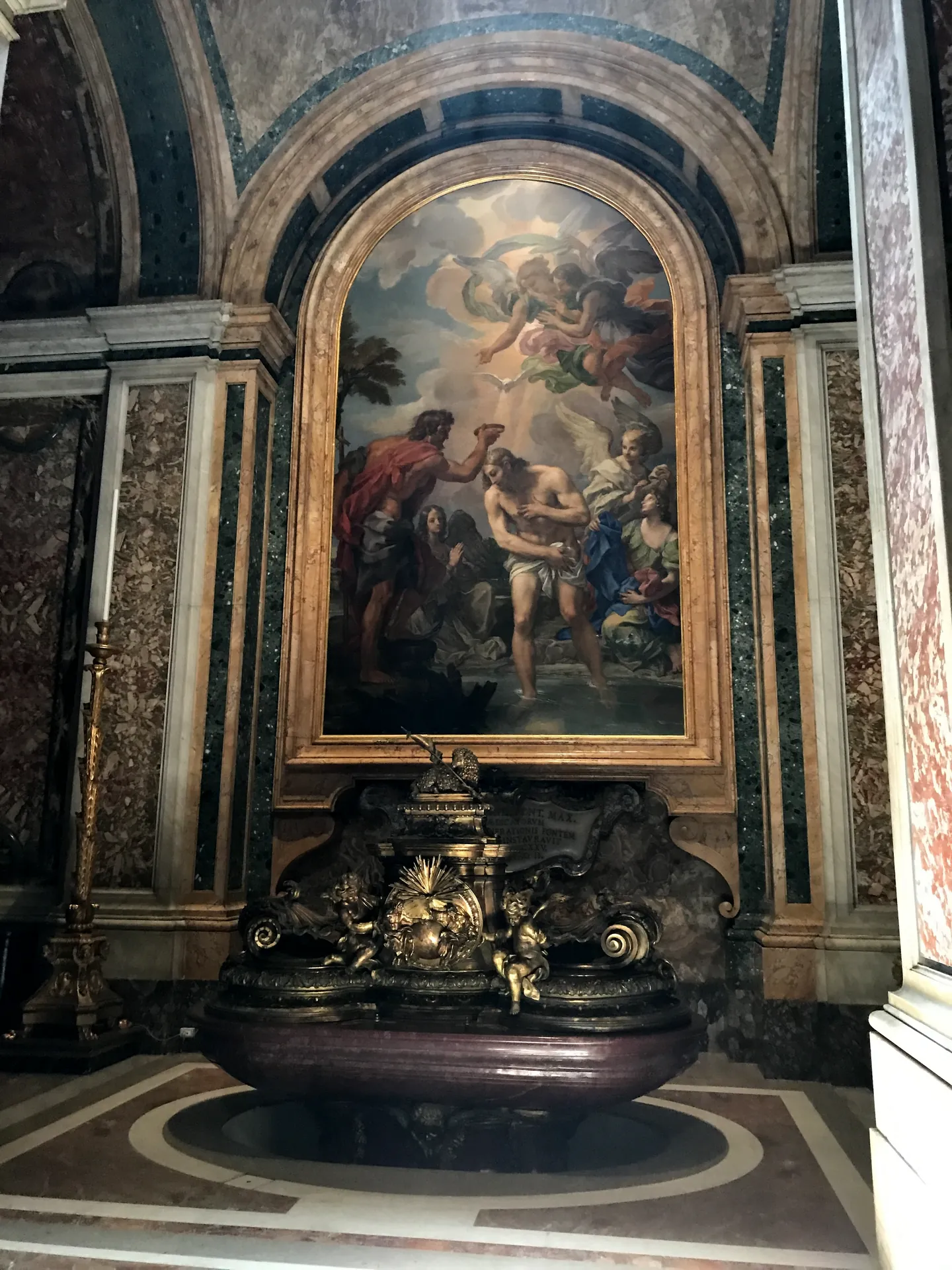The porphyry baptismal font with gilded cover in St. Peter's Basilica