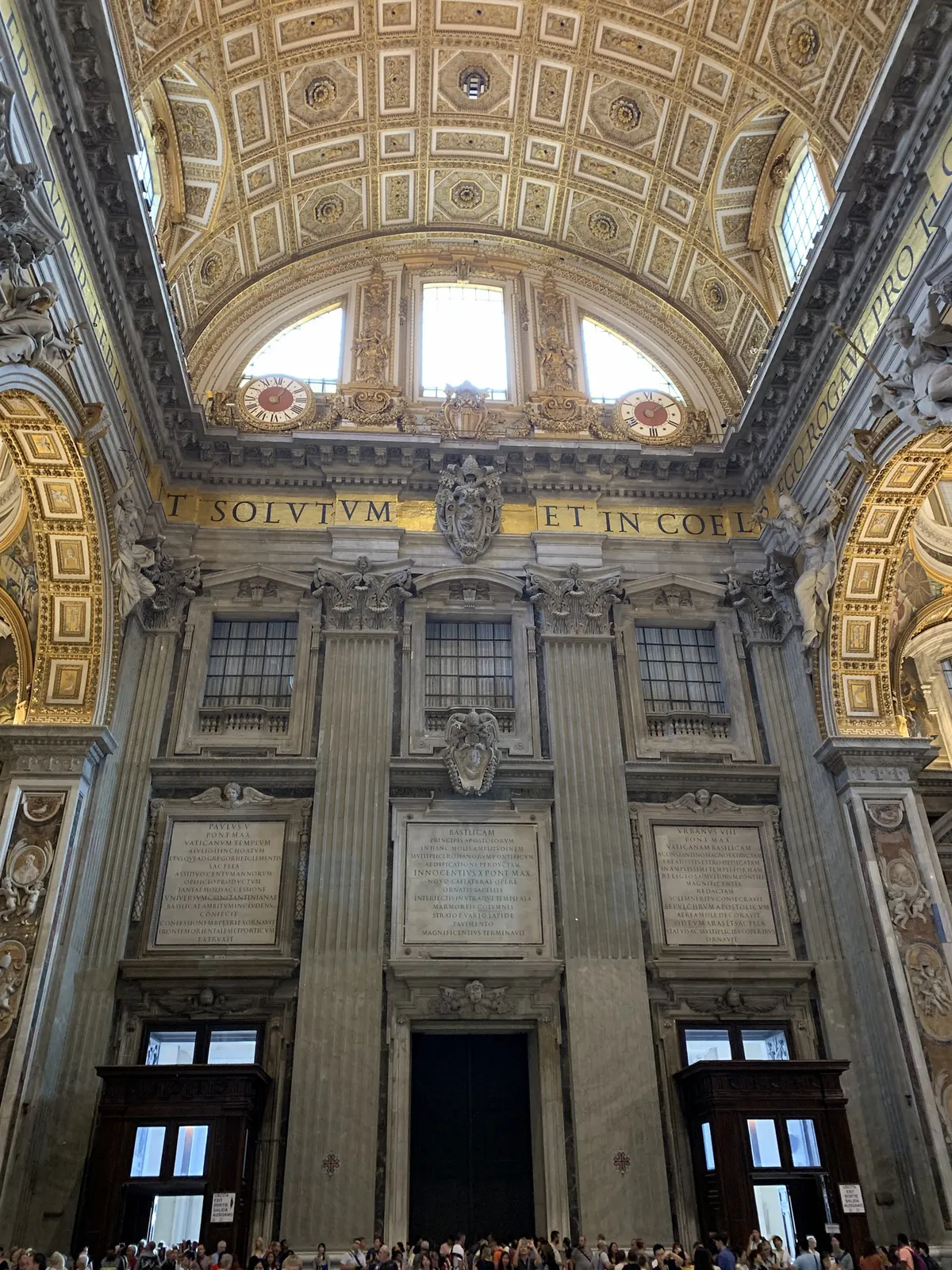 The crossing of St. Peter's looking up to the dome drum and its inscription