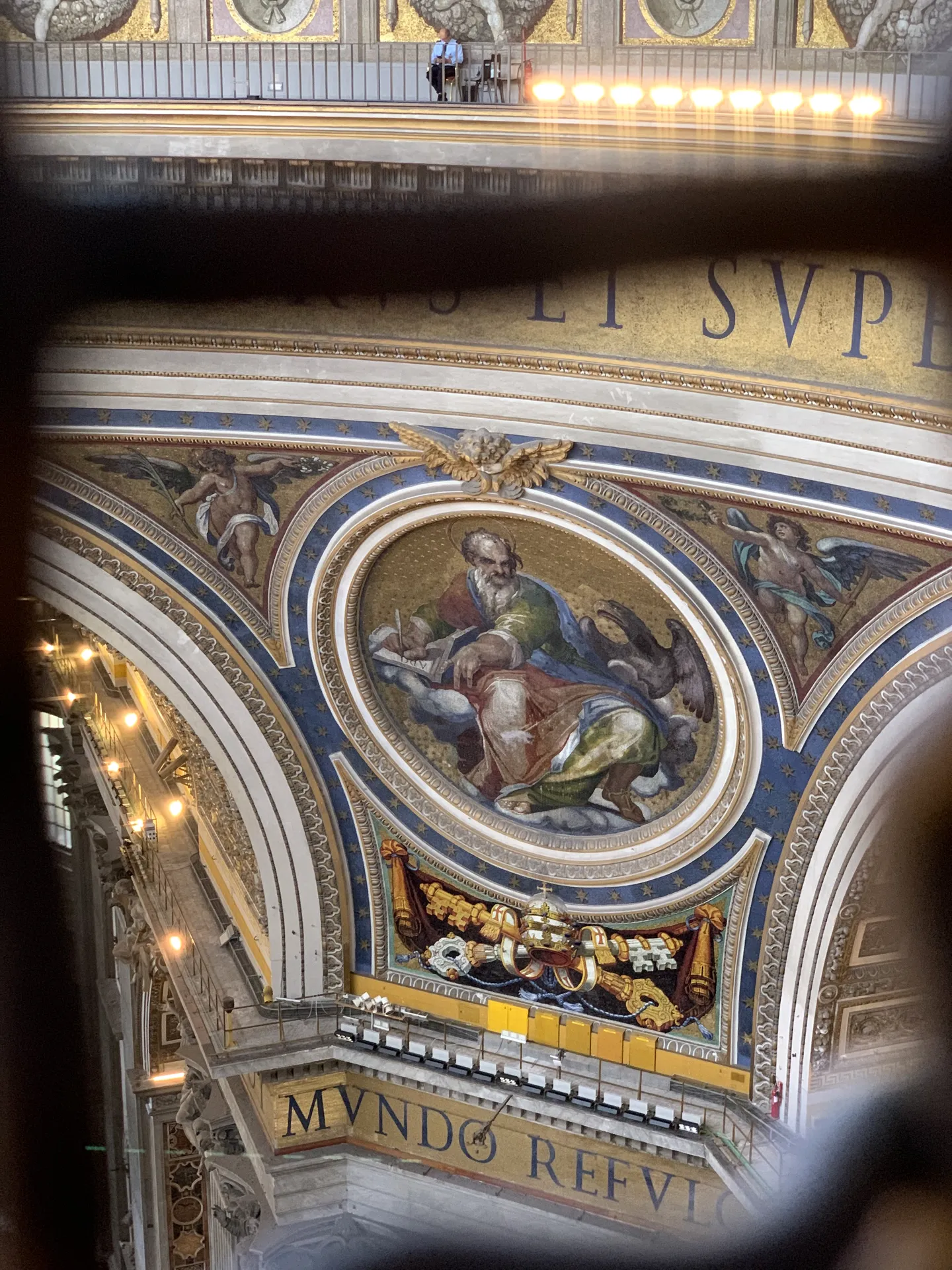 A colossal mosaic figure in a pendentive of the dome of St. Peter's Basilica