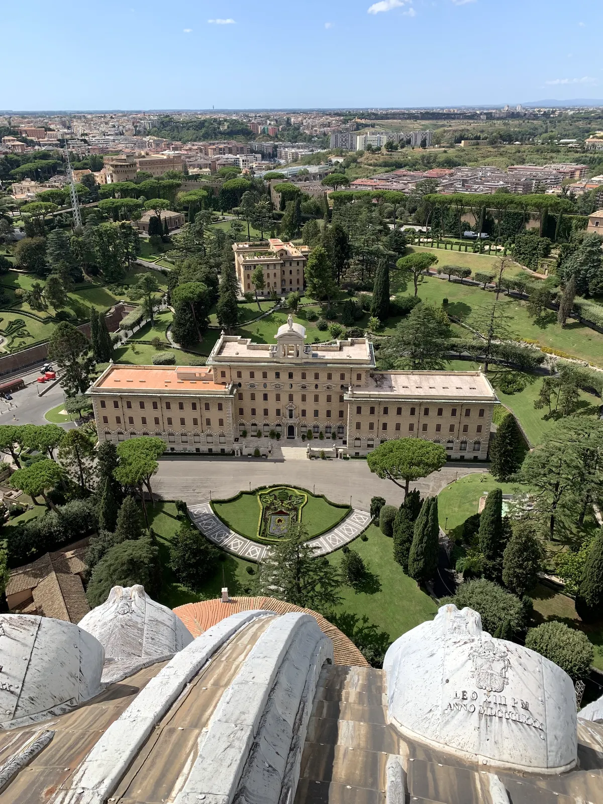 Looking down the stone ribs of St. Peter's dome toward the Vatican Gardens