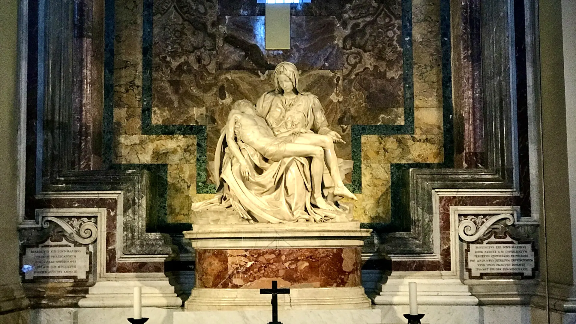 Close view of Michelangelo's Pieta behind protective glass in St. Peter's